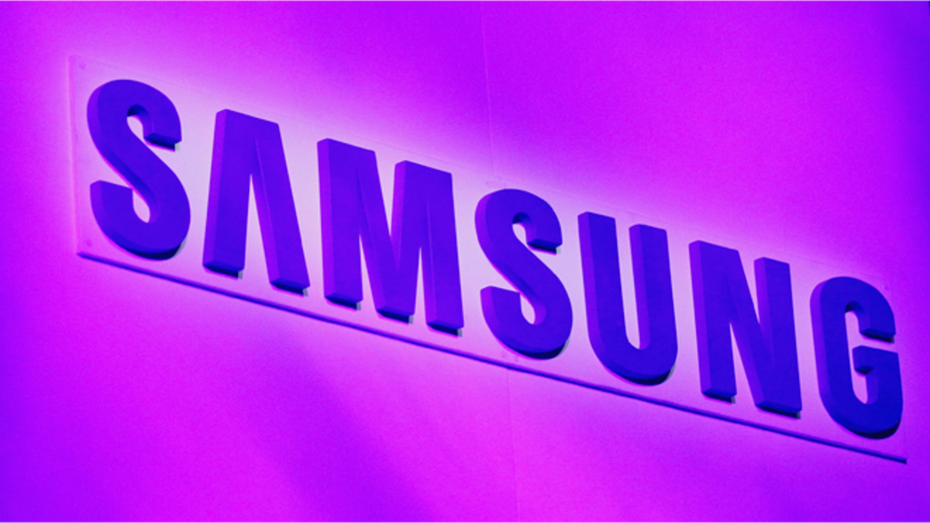 The company logo is displayed at the Samsung news conference at the Consumer Electronics Show (CES) in Las Vegas January 7, 2013.