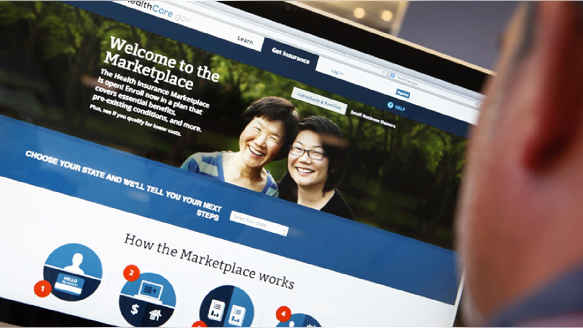 A man looks over the Affordable Care Act (commonly known as Obamacare) signup page on the HealthCare.gov website.