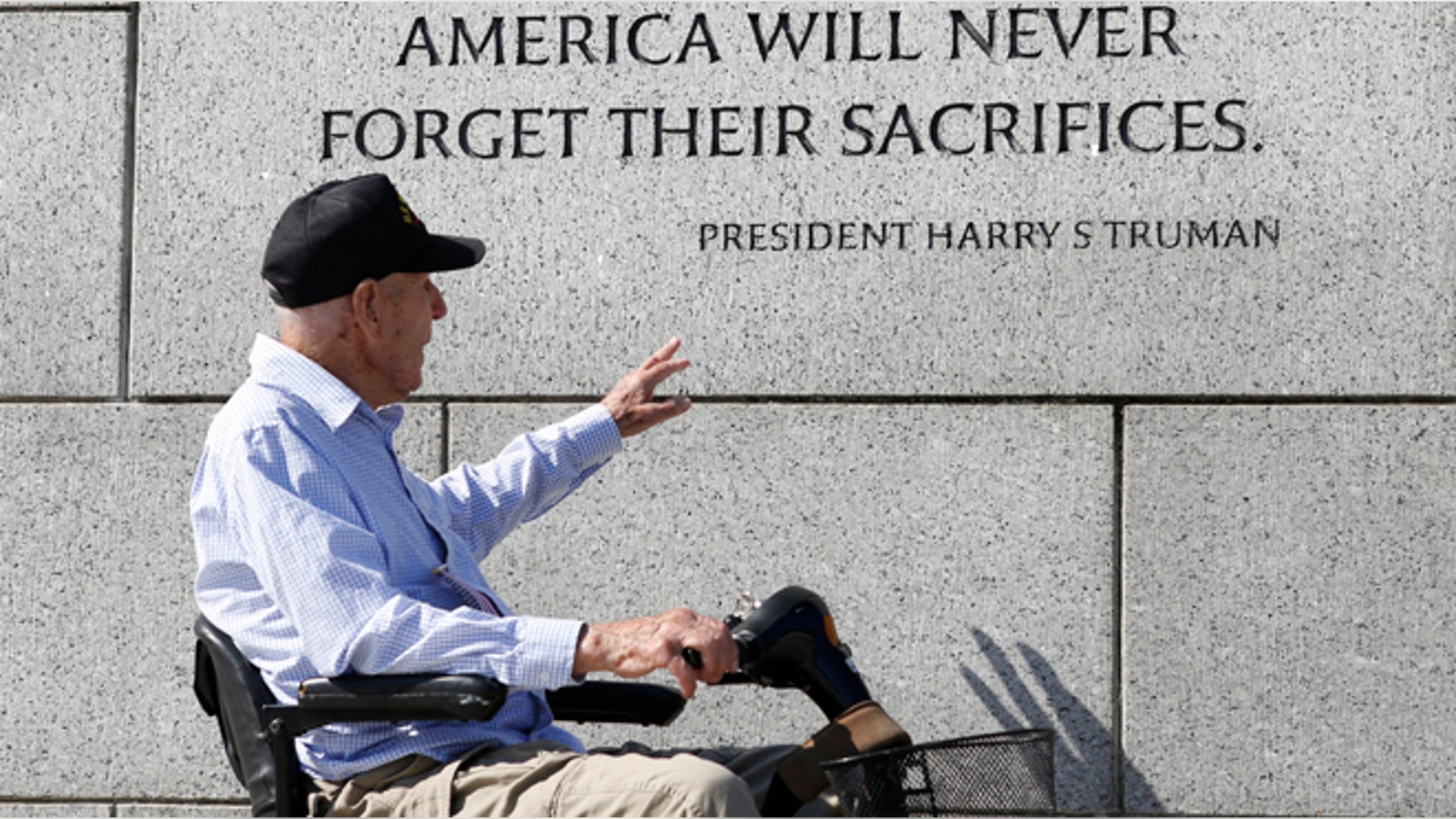 A World War Two veteran tours the World War Two Memorial in Washington.