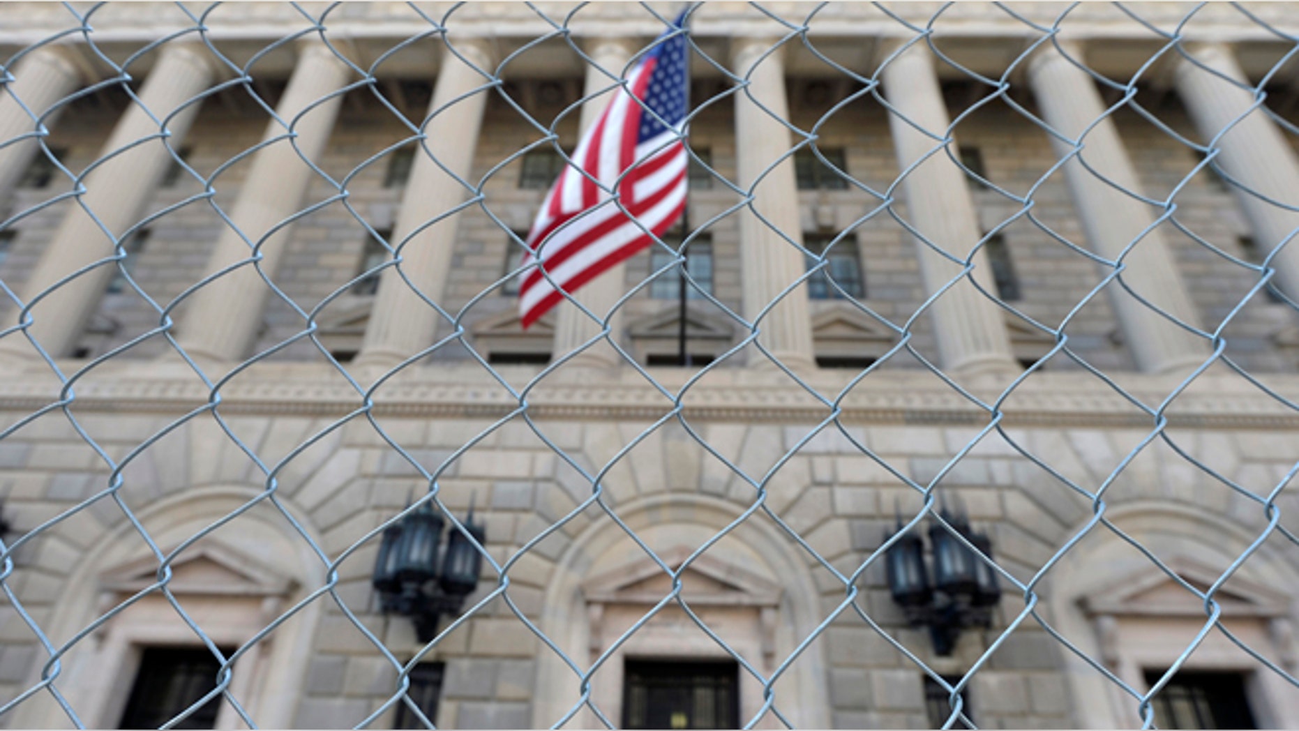 A fence surrounds the U.S. Department of Commerce in Washington October 5, 2013.