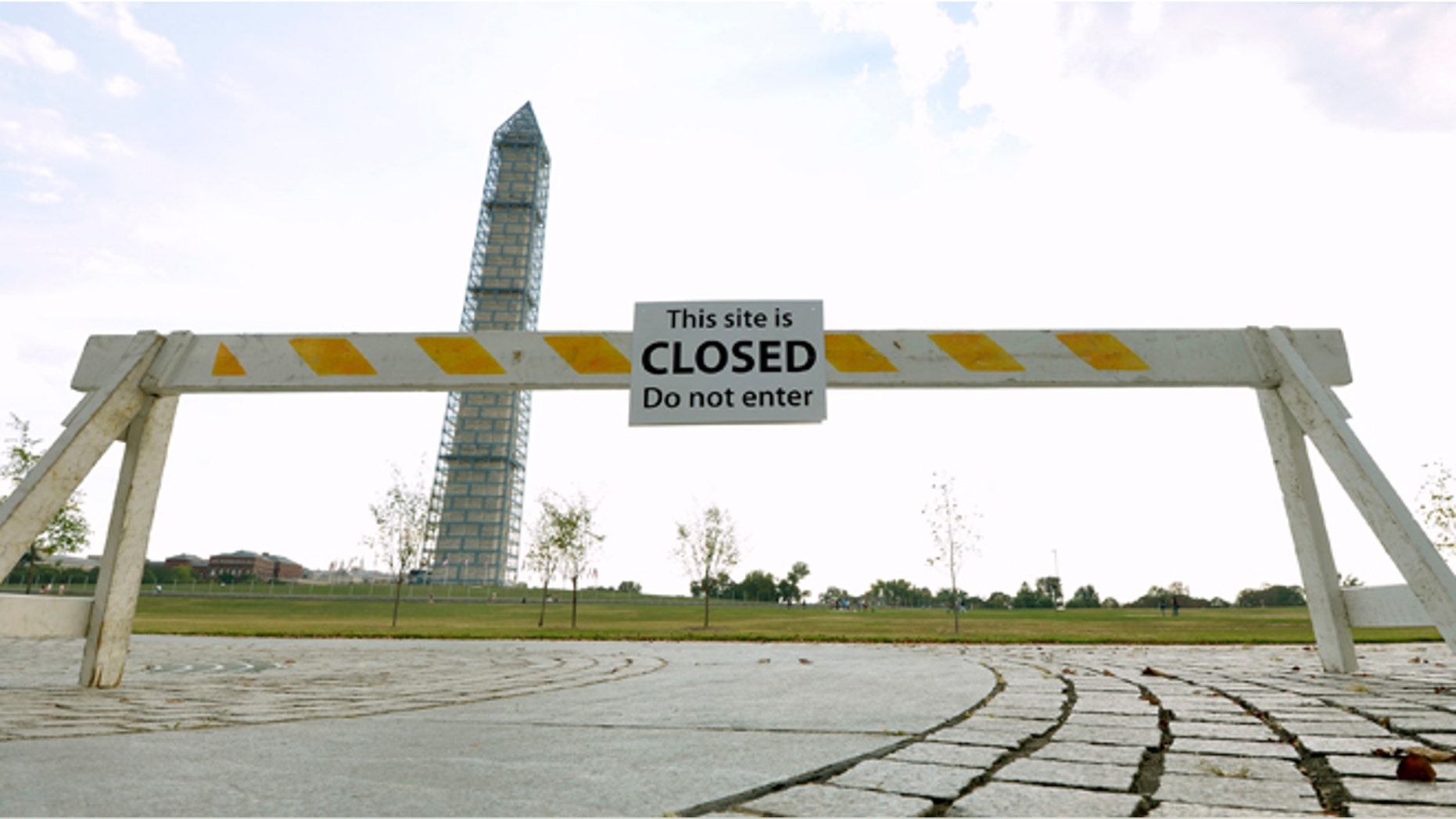 A barrier sits near the Washington Monument.