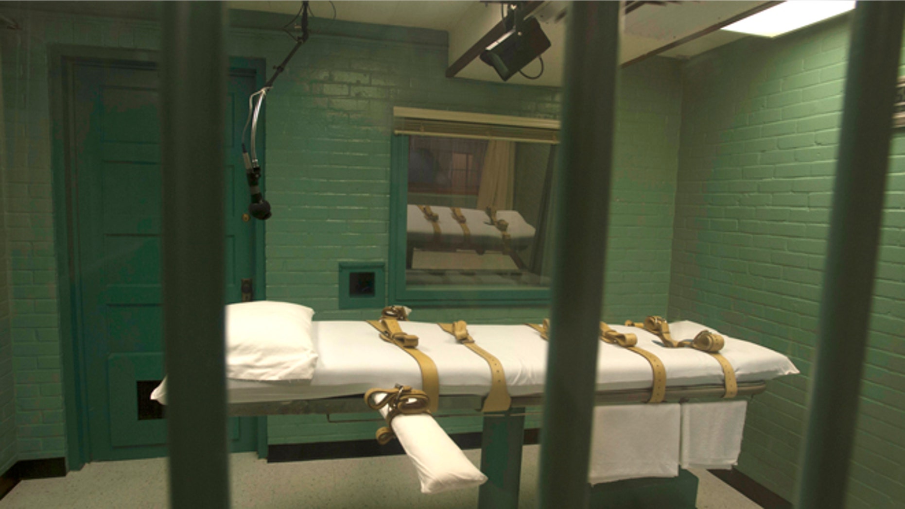 Sept. 29, 2010: The death chamber is seen through the steel bars from the viewing room at the state penitentiary in Huntsville, Texas.