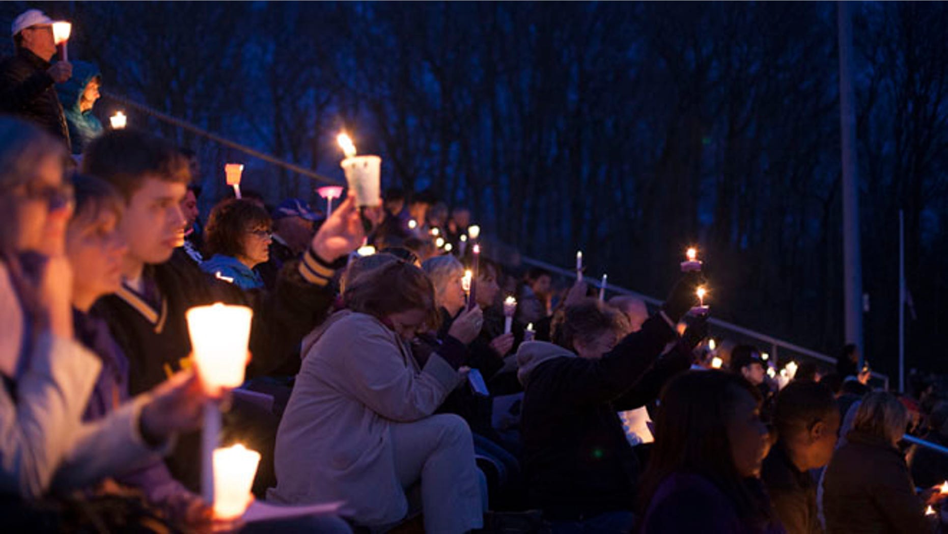 April 28, 2014: People gather at Jonathan Law High School during a vigil for slain student Maren Sanchez in Milford, Connecticut.