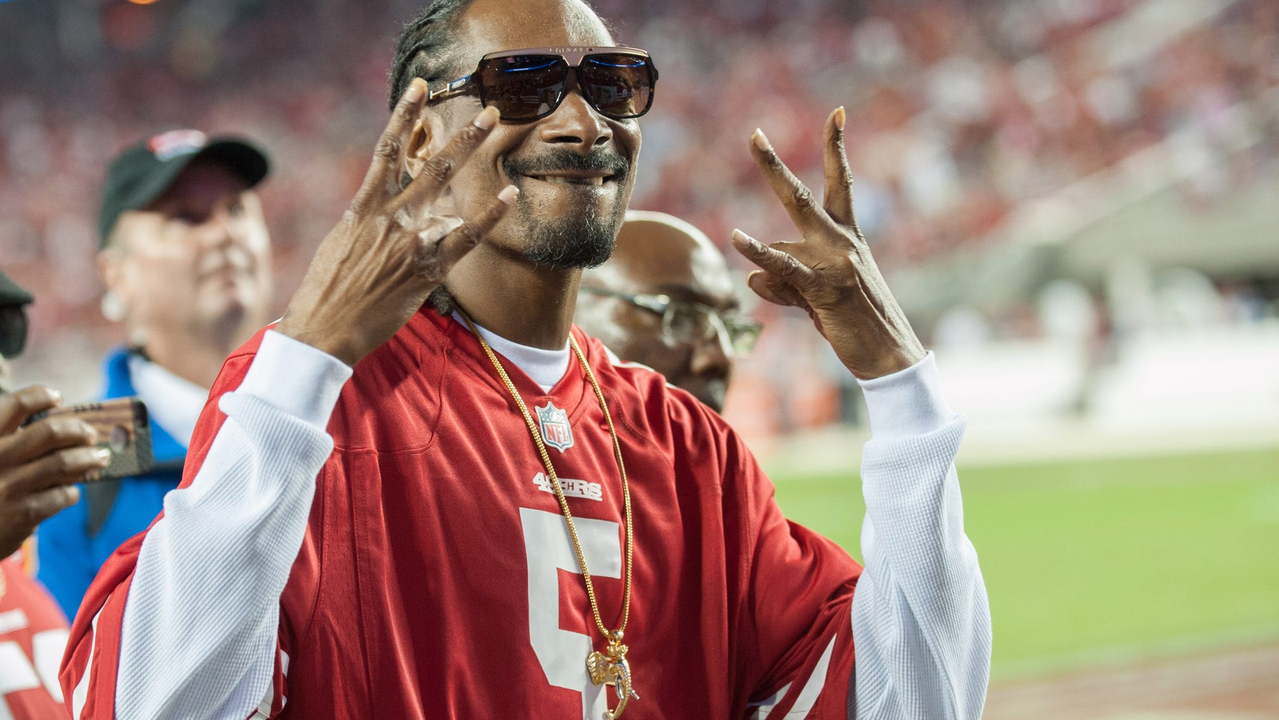 Music artist Snoop Dogg reacts to the crowd after performing during the halftime show at Levi's Stadium. (Ed Szczepanski-USA TODAY Sports)