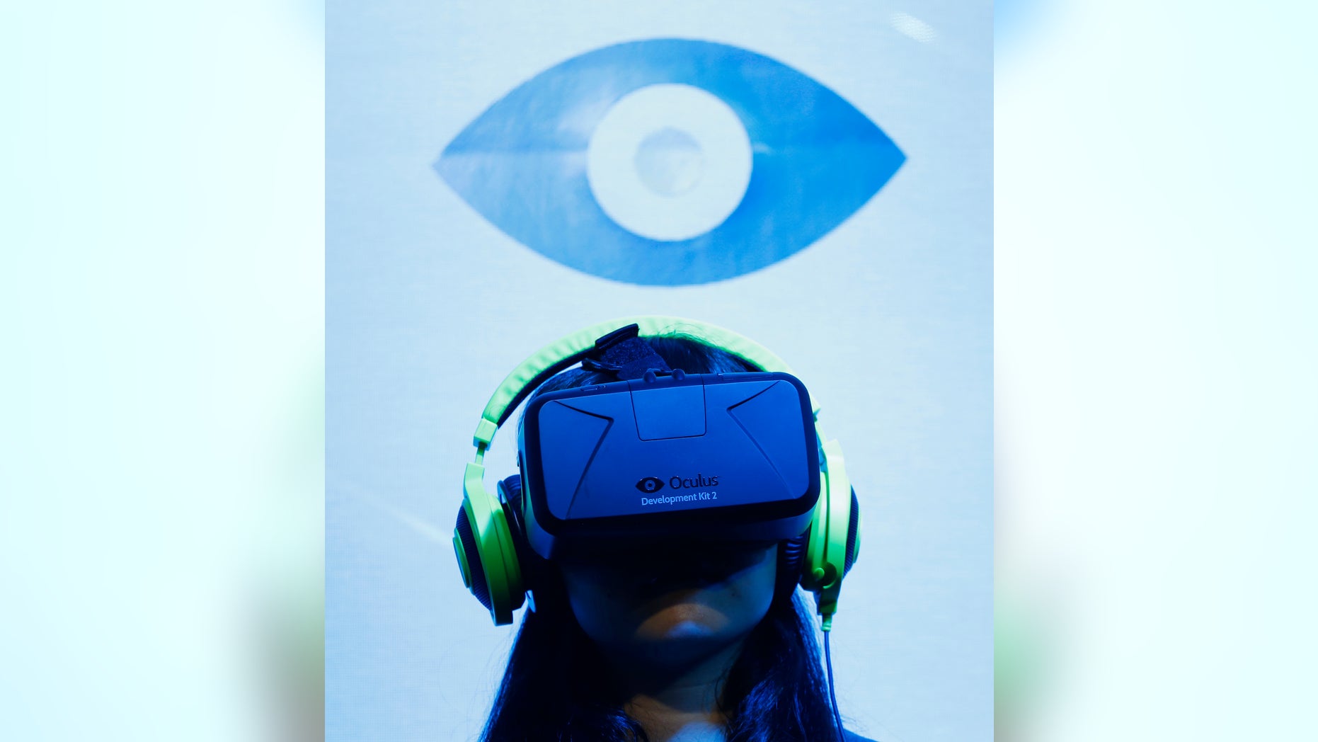 A woman tries out out Oculus VR's headset Oculus rift development kit 2 at its booth in Tokyo Game Show 2014 in Makuhari, east of Tokyo September 18, 2014.