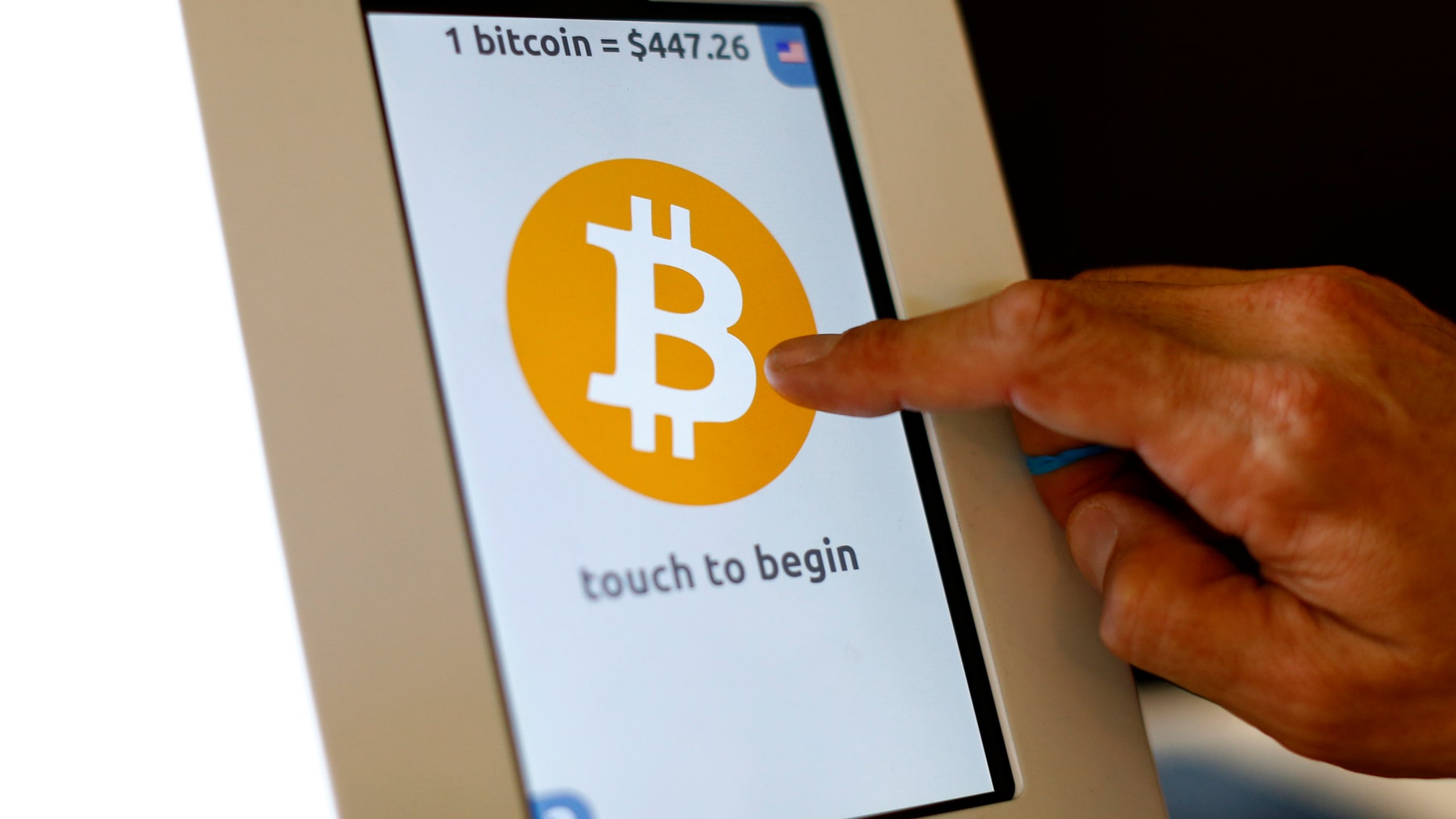 File photo. A bitcoin ATM machine is shown at a restaurant in San Diego, California.