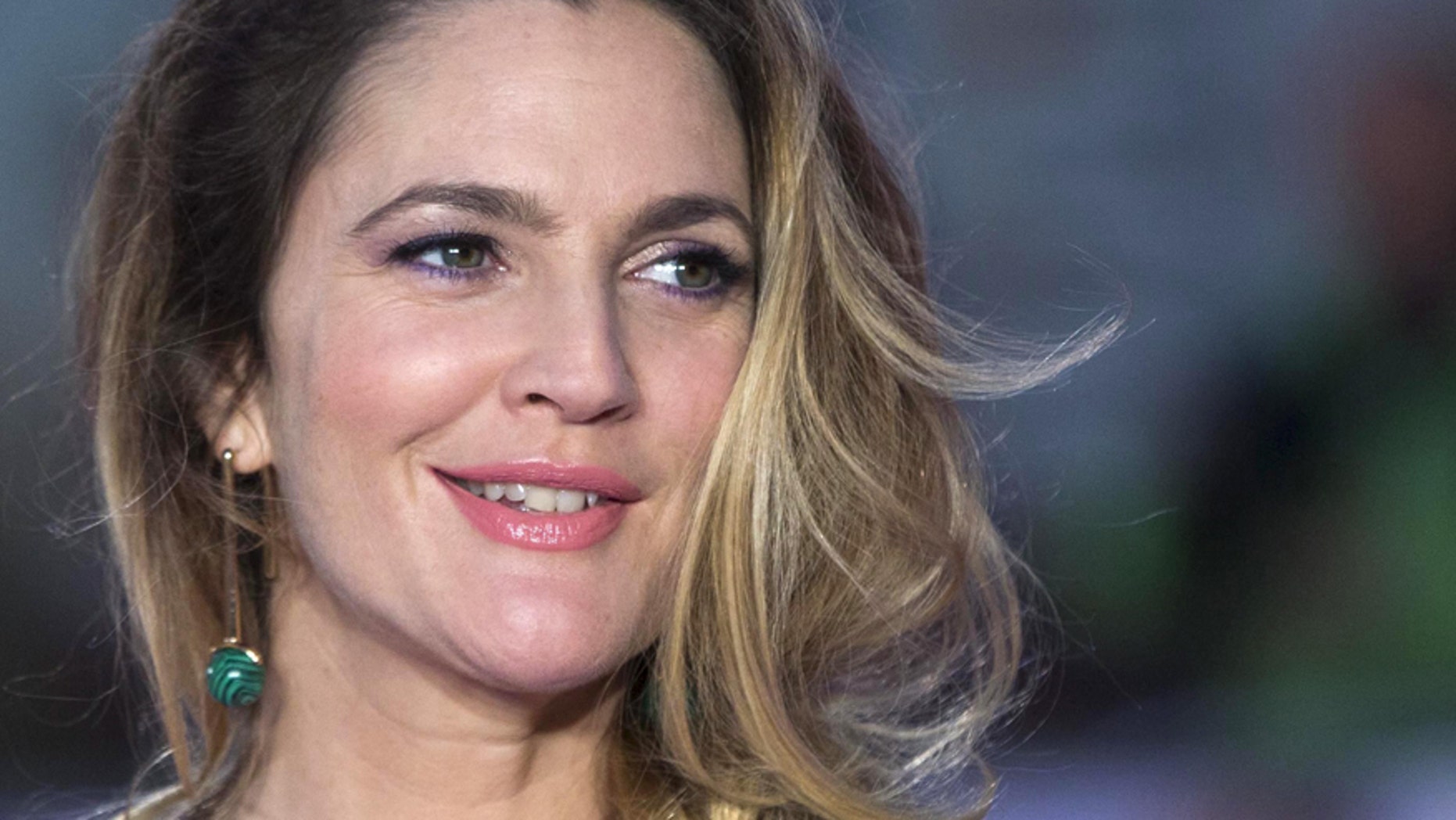 U.S. actress Drew Barrymore poses for photographers at the European premiere of the film "Miss You Already" in London September 17, 2015.