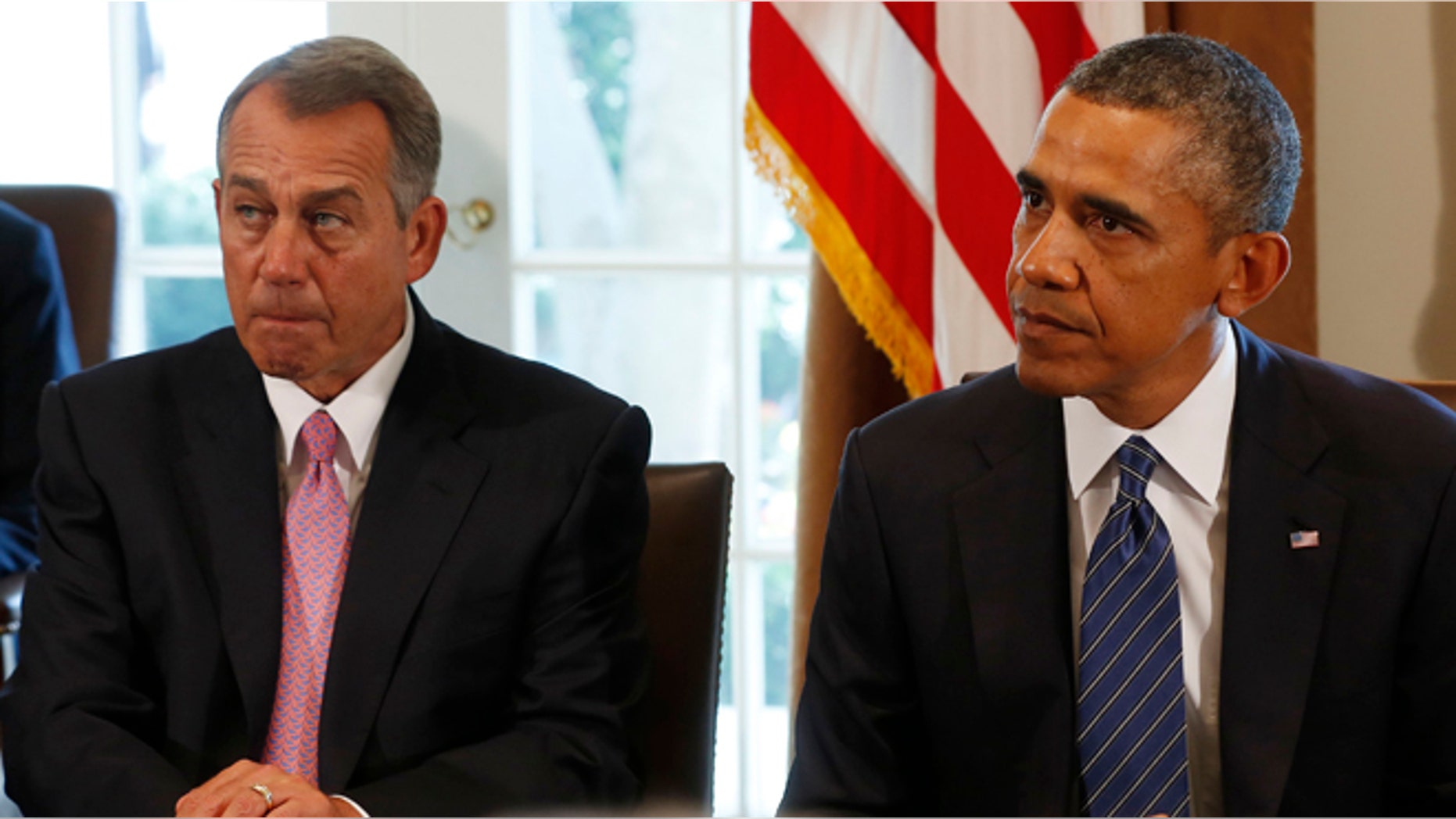 Speaker of the House John Boehner (L) sits next to U.S. President Barack Obama as attends a meeting with bipartisan Congressional leaders in the Cabinet Room at the White House in Washington, September 3, 2013.