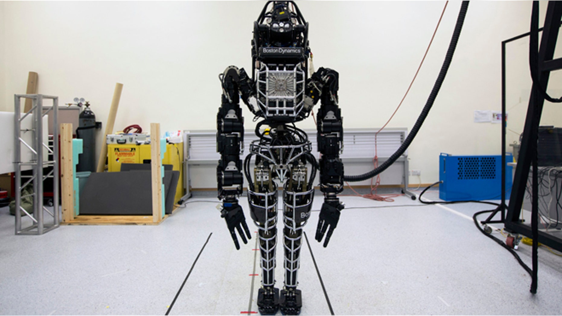 Bipedal humanoid robot "Atlas", primarily developed by the American robotics company Boston Dynamics, is presented to the media during a news conference at the University of Hong Kong October 17, 2013. Google recently acquired the company.