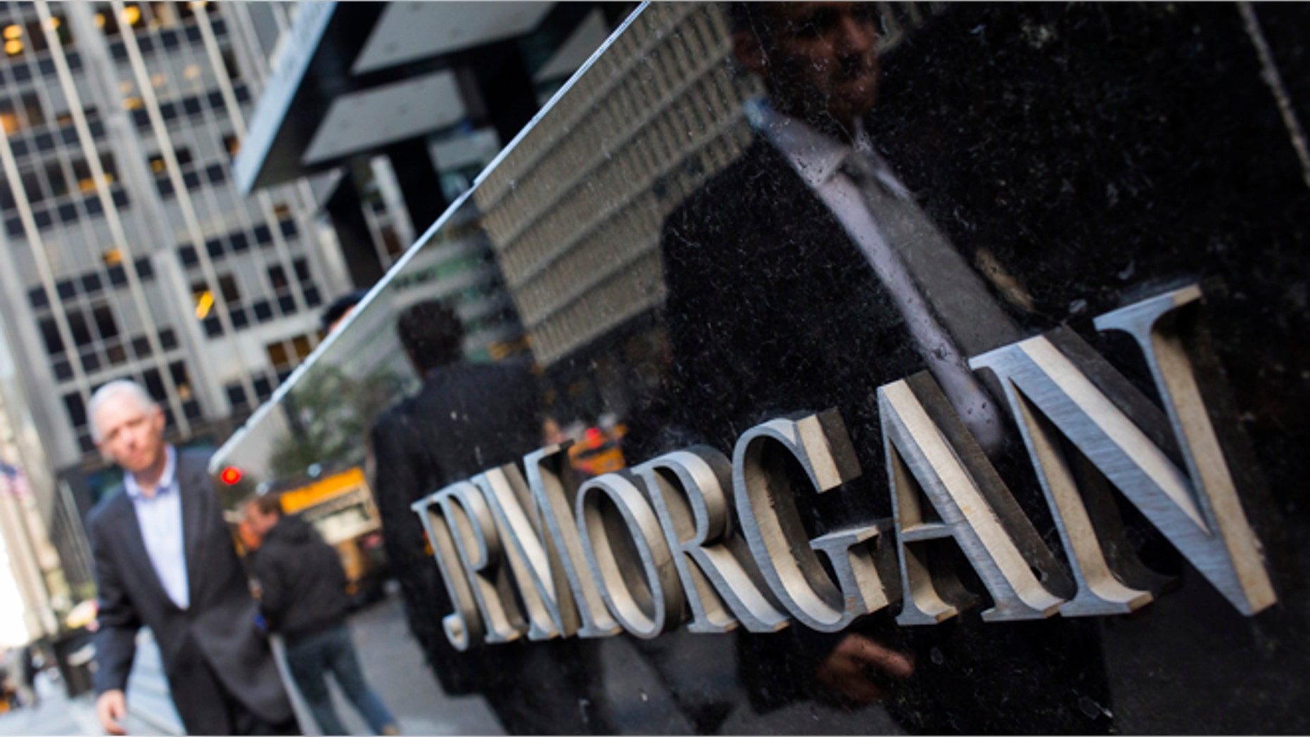 People walk by the JP Morgan & Chase Co. building in New York.