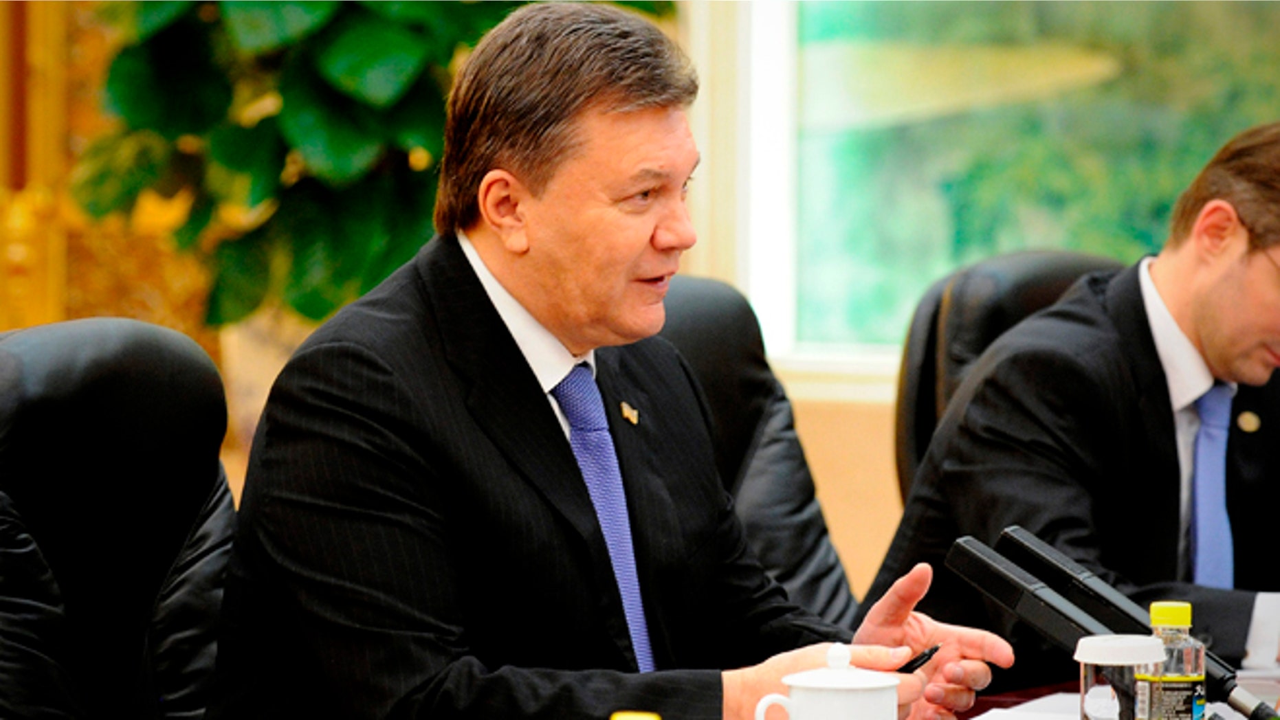 Dec. 6, 2013: Ukrainian President Viktor Yanukovych (L) meets with Chinese Premier Li Keqiang (not pictured) at the Great Hall of the People in Beijing.