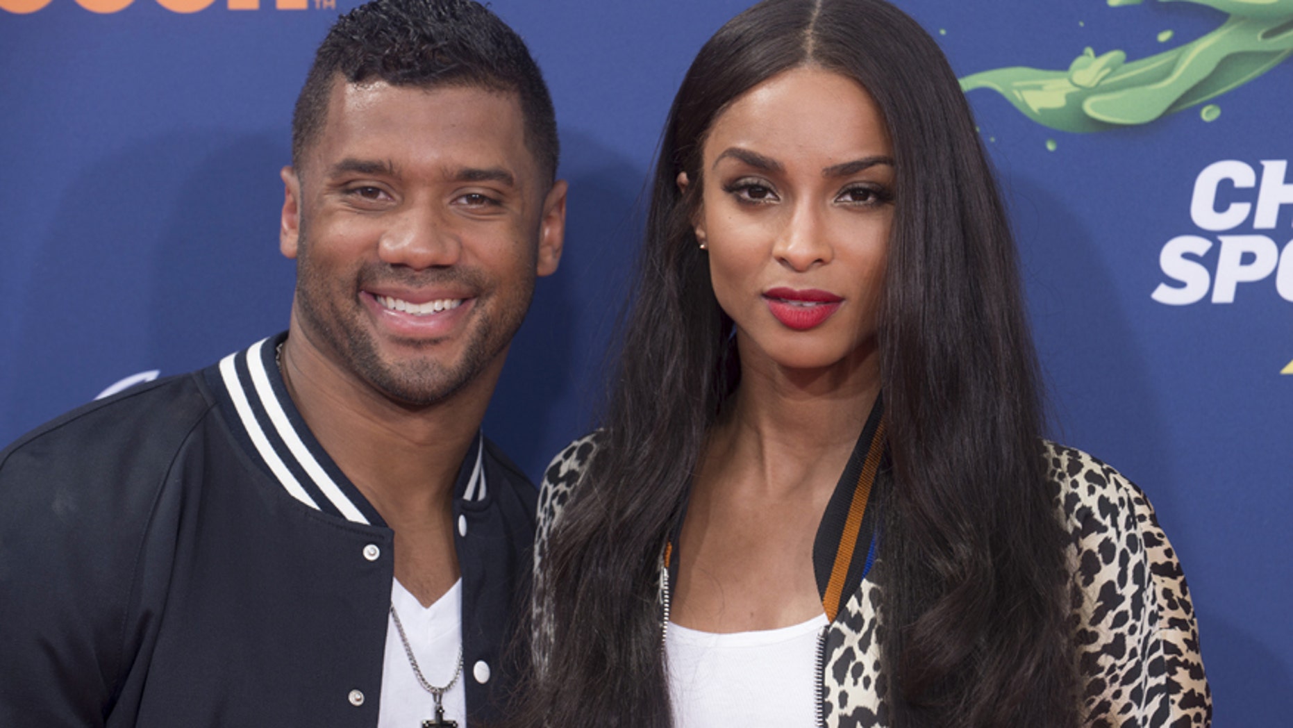 NFL player Russell Wilson (L) and recording artist Ciara attend Nickelodeon's "Kid's Choice Sports 2015" in Los Angeles July 16, 2015.
