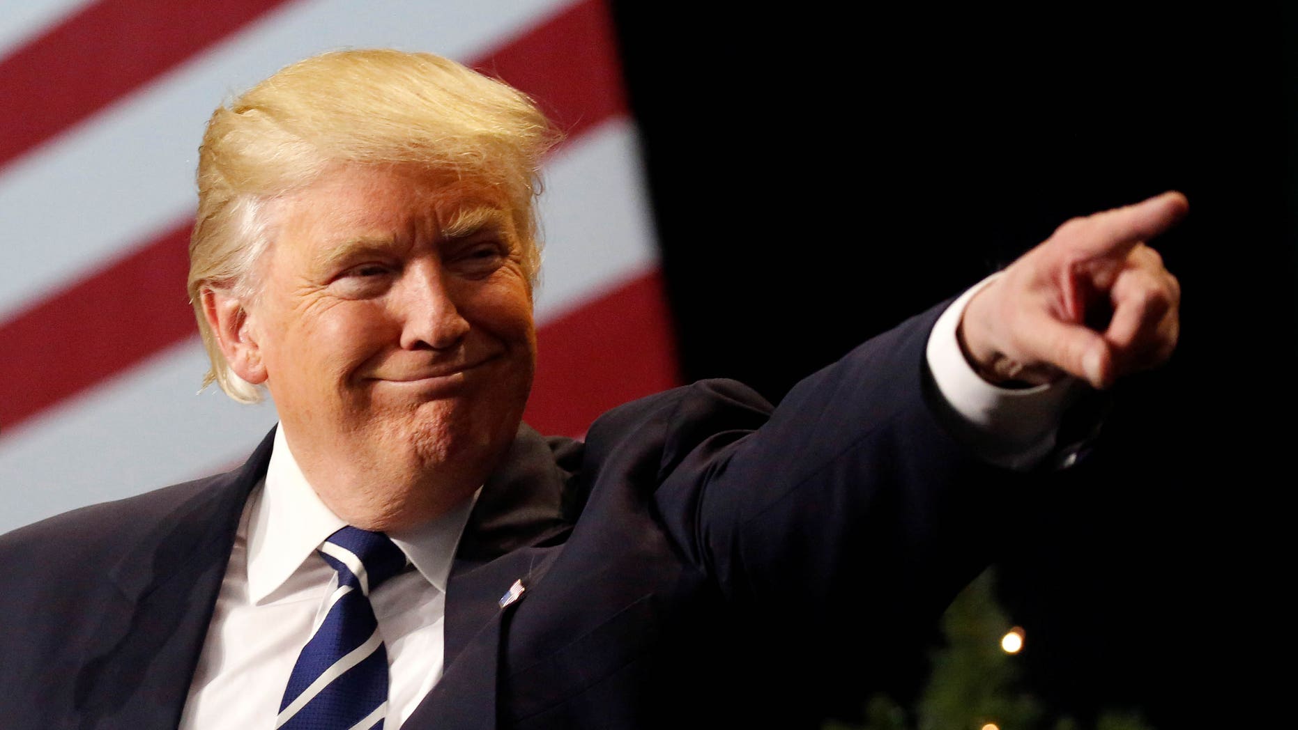 U.S. President-elect Donald Trump speaks at the USA Thank You Tour event at the Wisconsin State Fair Exposition Center in West Allis, Wisconsin, U.S., December 13, 2016. REUTERS/Shannon Stapleton - RTX2UX1U