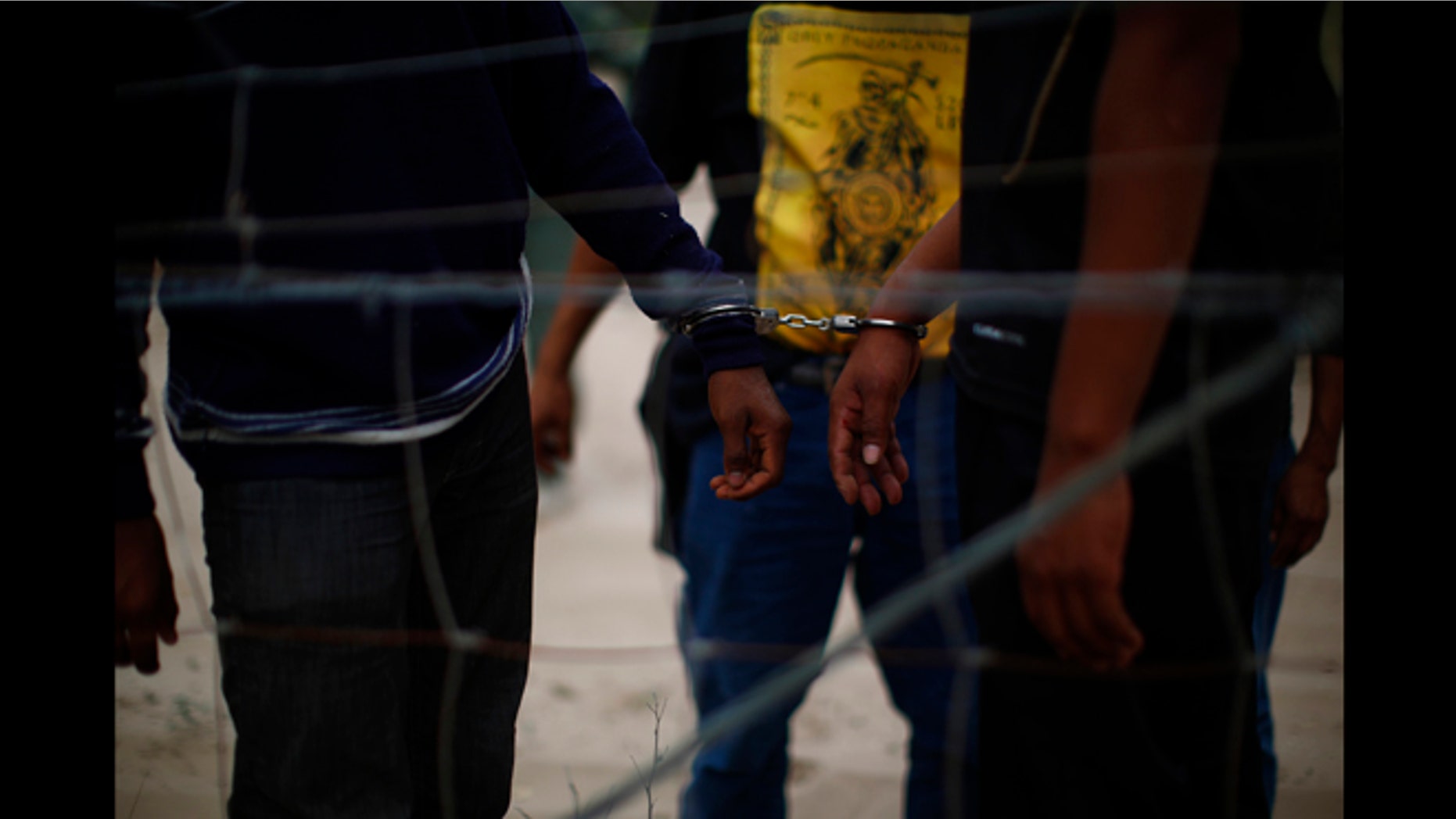 March 29, 2013: People are taken into custody by U.S. Border Patrol near Falfurrias, Texas.