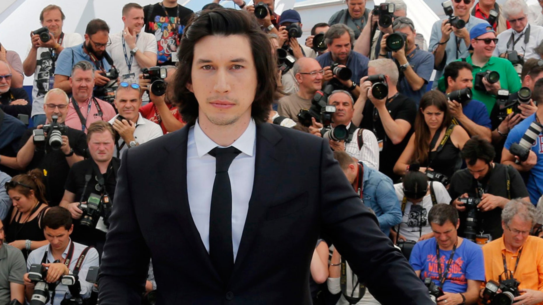 Cast member Adam Driver poses during a photocall for the film "Paterson" in competition at the 69th Cannes Film Festival in Cannes, France, May 16, 2016.