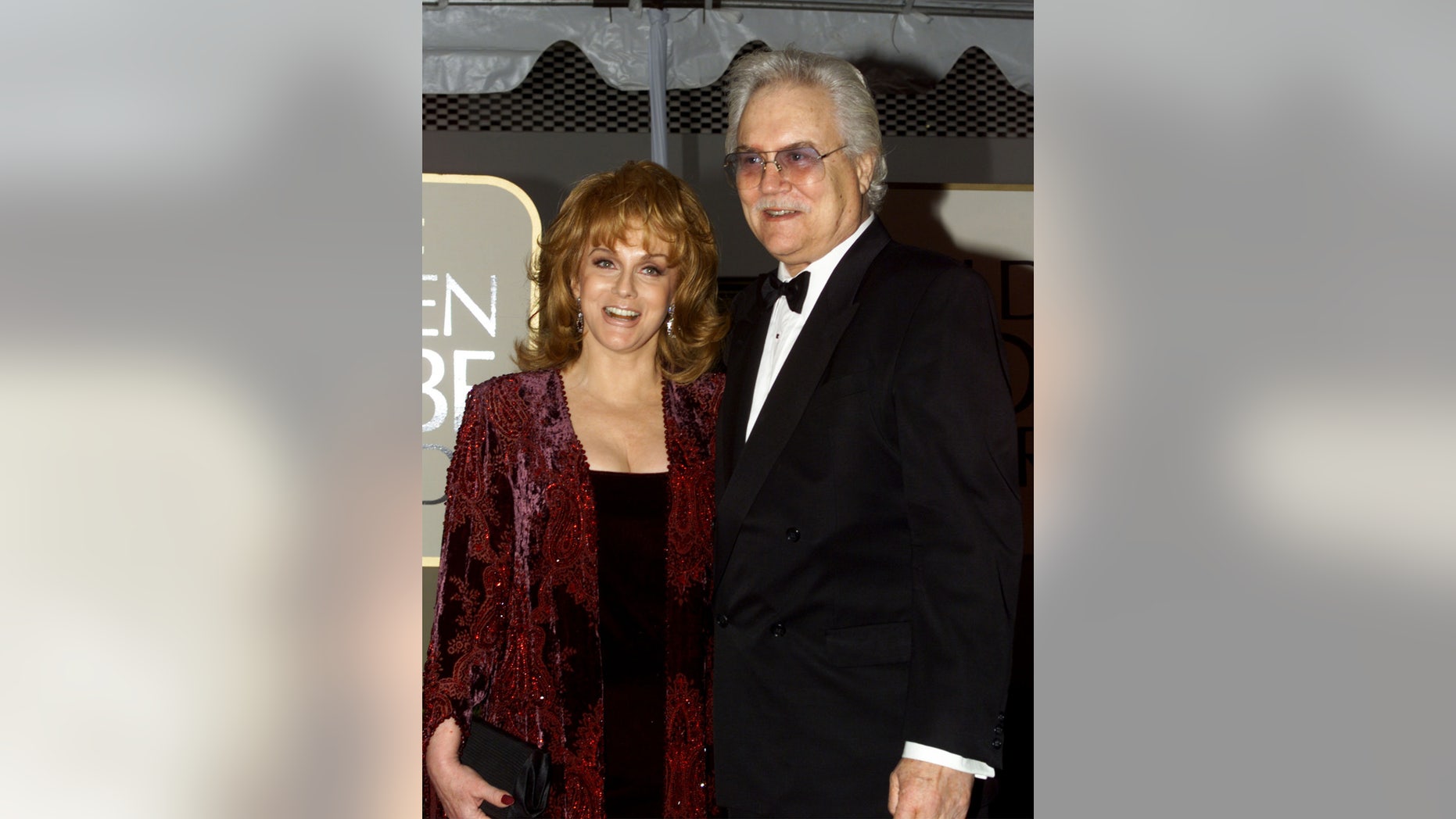 Actress Ann Margaret and her husband Roger Smith arrive at the 56th annual Golden Globe Awards ceremony in Beverly Hills, January 24, 1999.