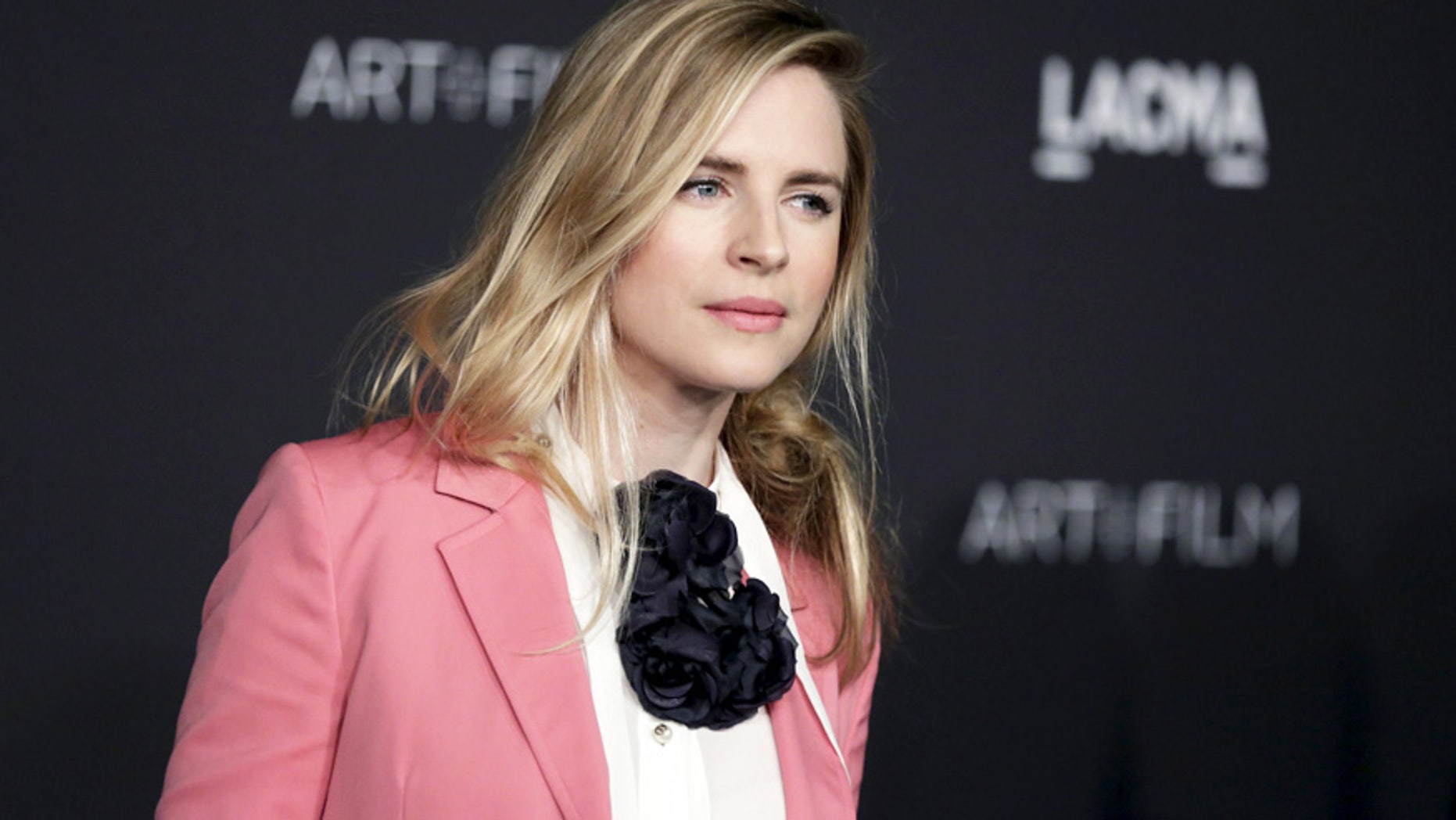 American actress and film producer Brit Marling is wearing a millennial pink-inspired suit, which is being hailed as one of the top fashion trends for spring.