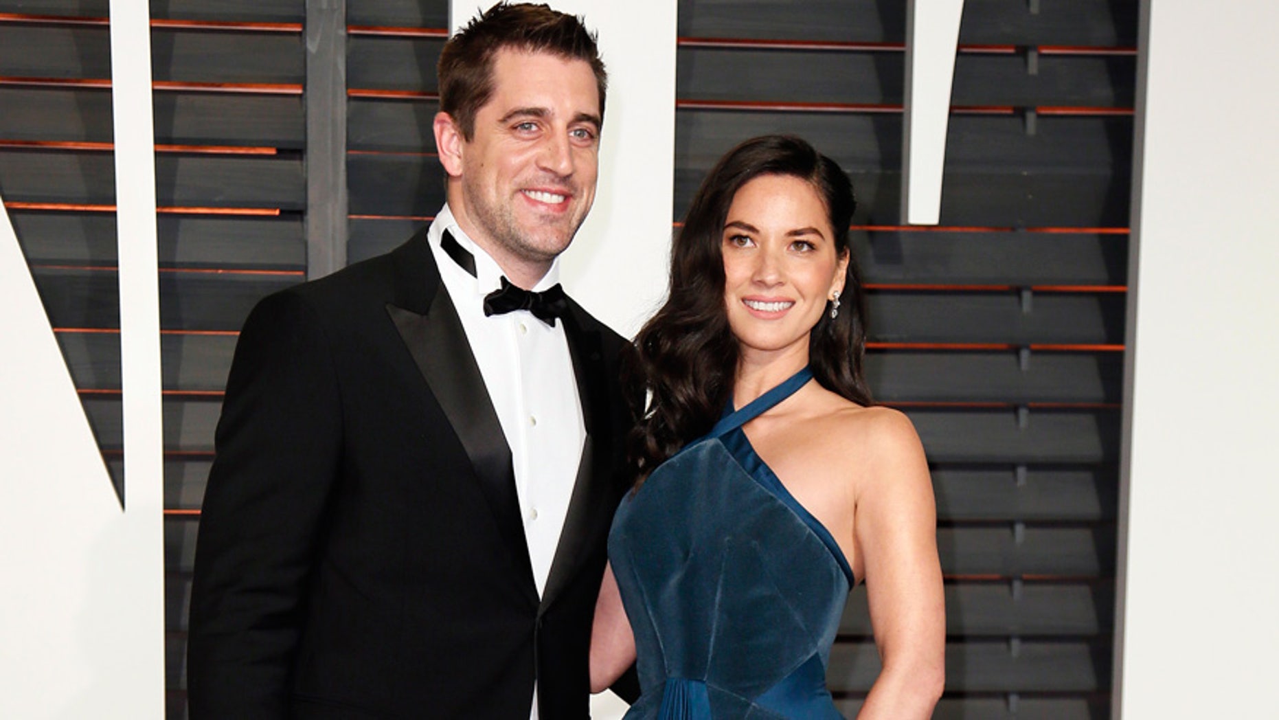 NFL football player Aaron Rodgers and actress Olivia Munn arrive at the 2015 Vanity Fair Oscar Party in Beverly Hills, California February 22, 2015.