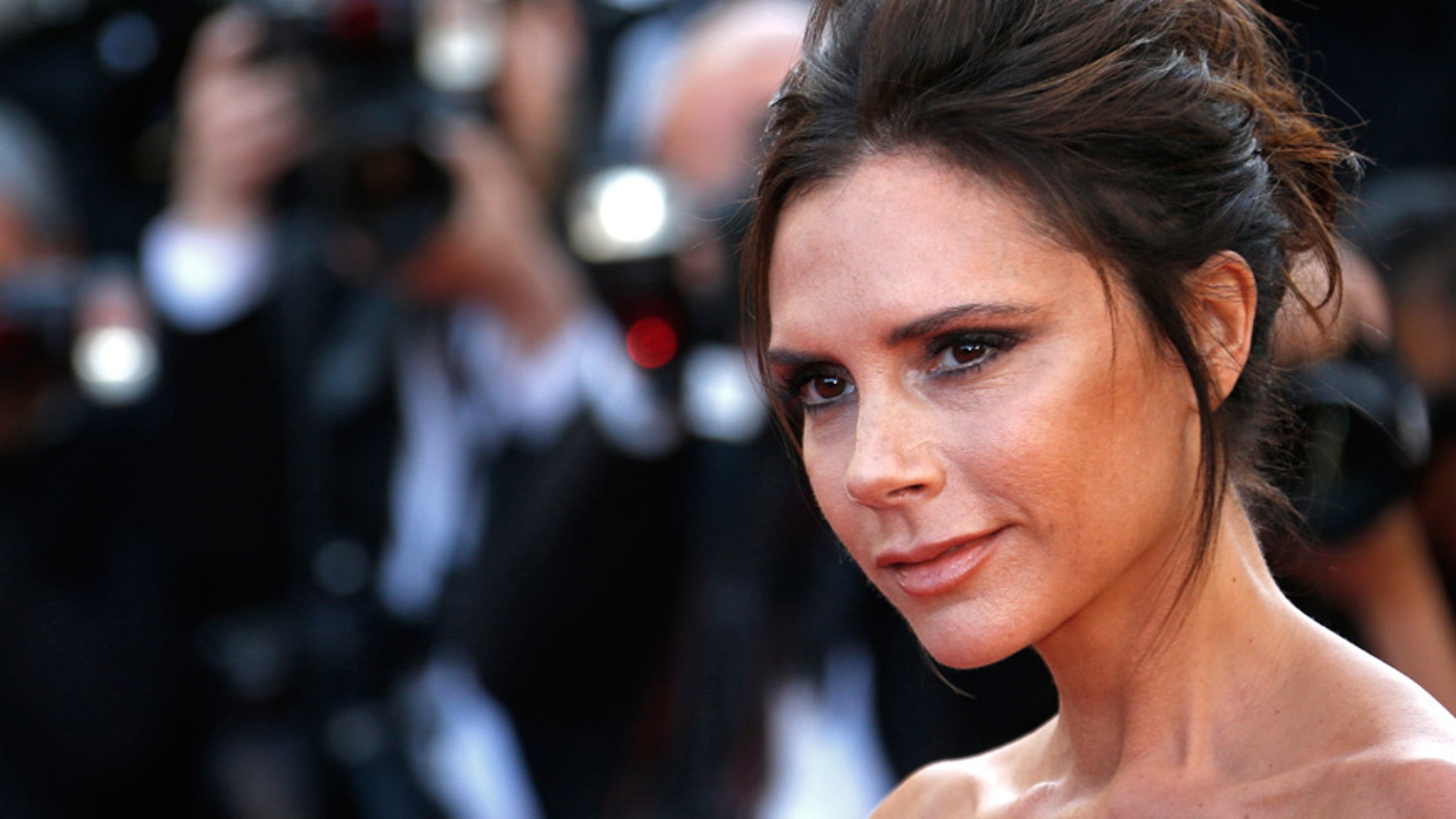 Victoria Beckham poses on the red carpet as she arrives for the opening ceremony and the screening of the film "Cafe Society" out of competition during the 69th Cannes Film Festival in Cannes, France.