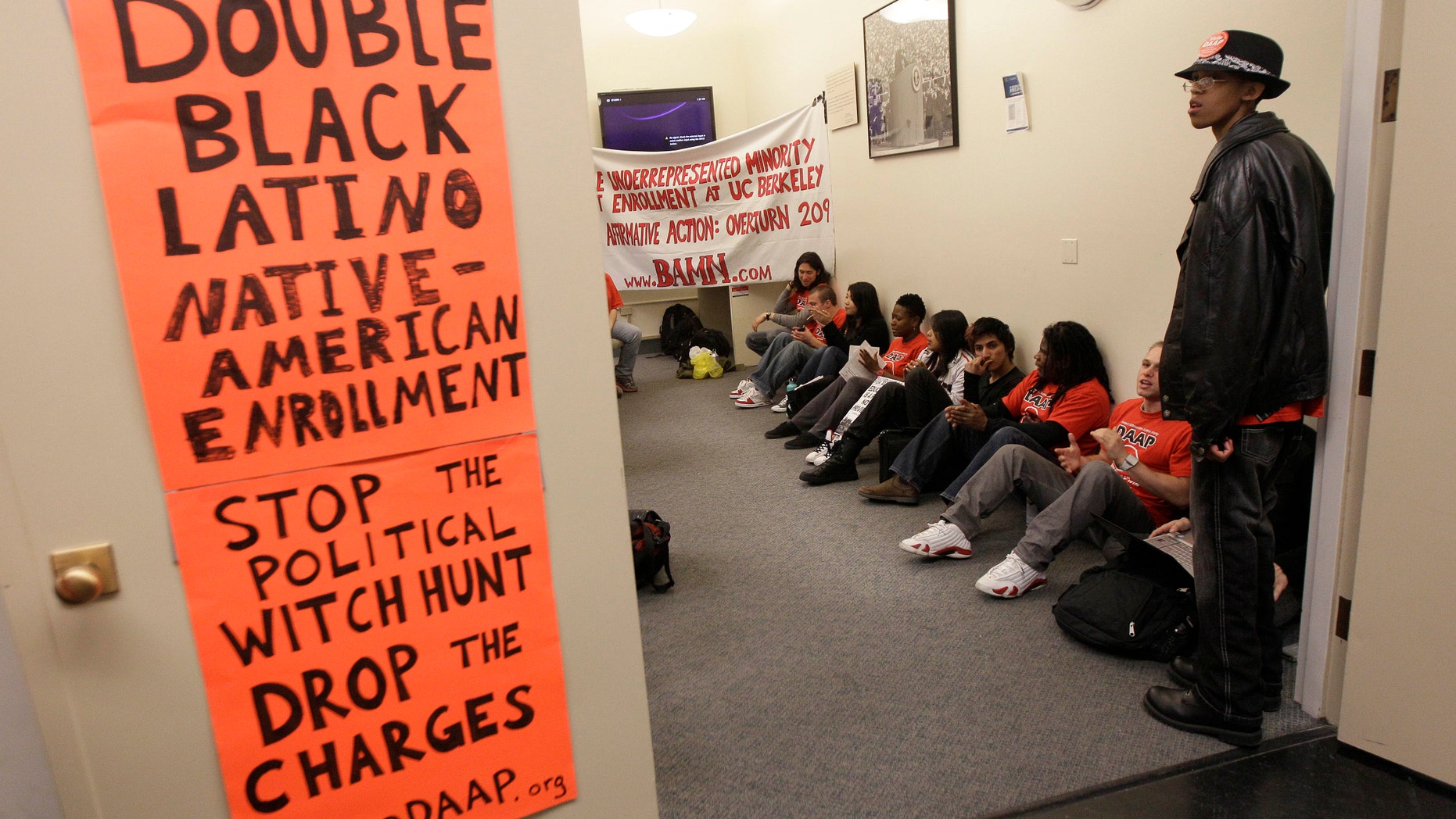 April 6, 2012: In this photo, protesters and students stage a sit in protest at the Sproul Hall Student Services Office at the University of California in Berkeley, Calif.