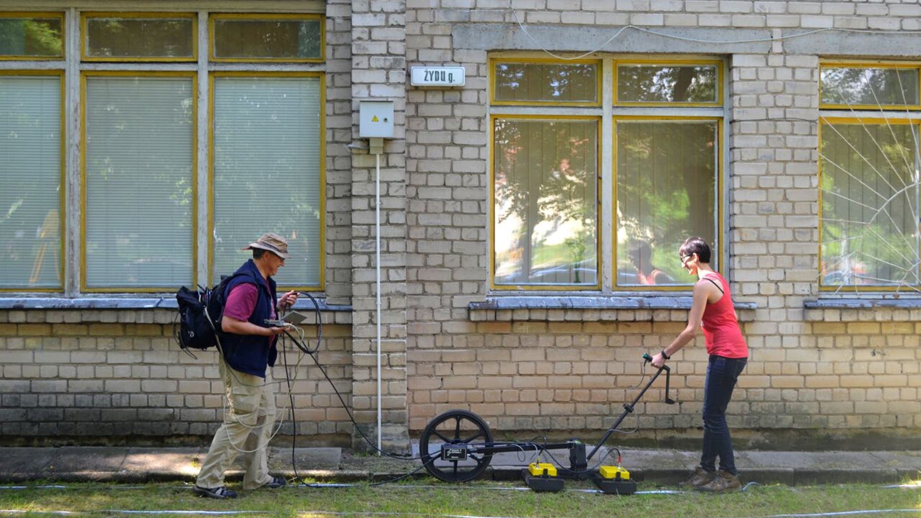 Prof. Harry Jol & Nicole Awad conducting a Ground Penetrating Radar survey at the site of the Great Synagogue of Vilna in Lithuania.
