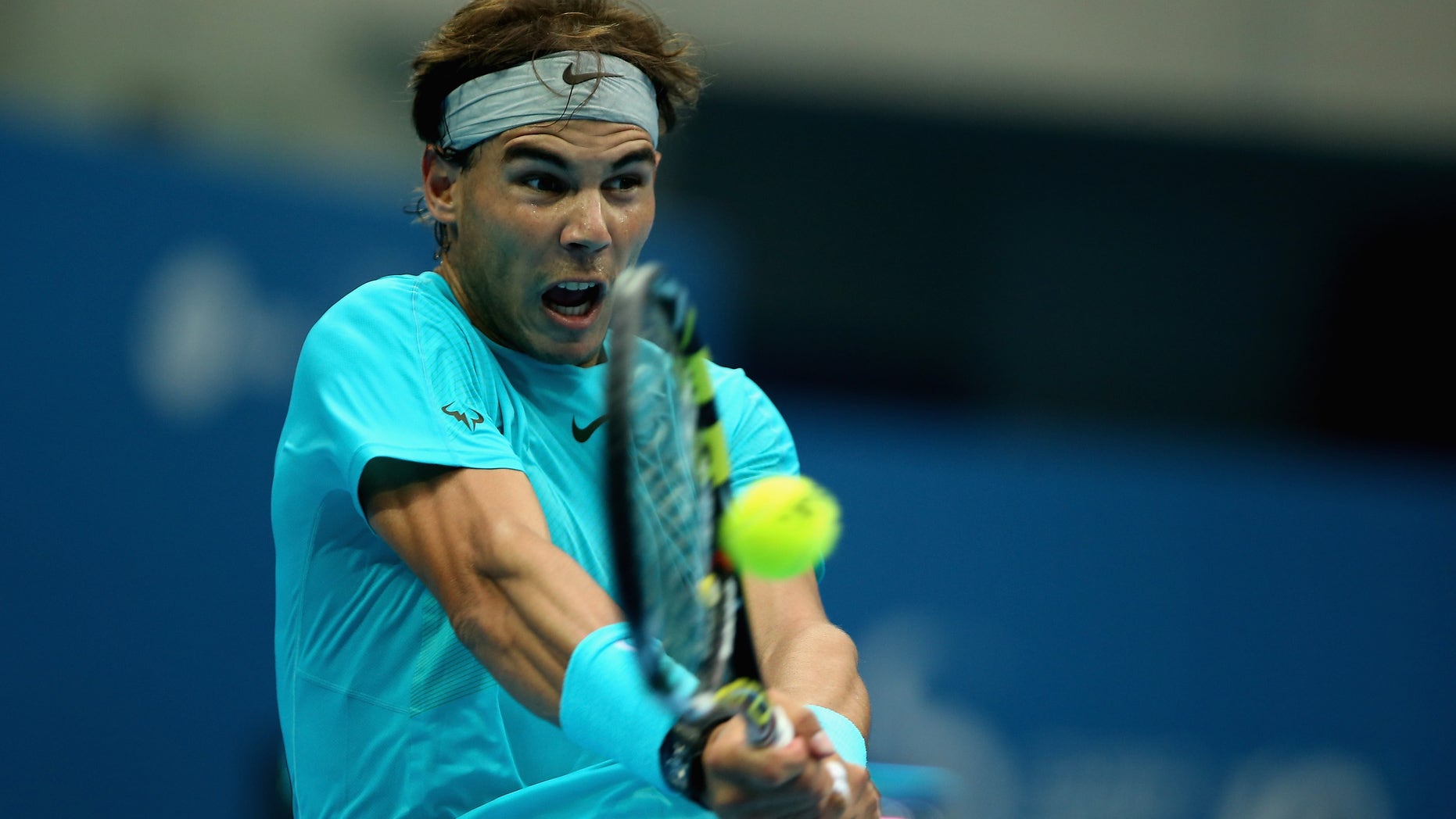 BEIJING, CHINA - OCTOBER 06: Rafael Nadal of Spain returns a shot against Novak Djokovic of Serbia during the Men's Single Final on night day of the China Open at the China National Tennis Center on October 6, 2013 in Beijing, China. (Photo by Feng Li/Getty Images)