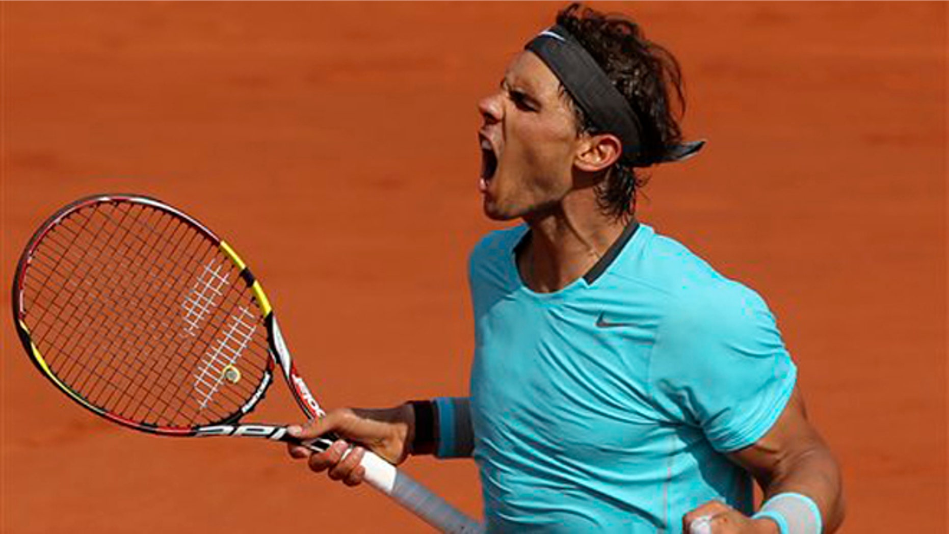 Spain's Rafael Nadal reacts as he wins the second set against Serbia's Novak Djokovic during their final match of the French Open tennis tournament at the Roland Garros stadium, in Paris, France, Sunday, June 8, 2014. (AP Photo/Thibault Camus)