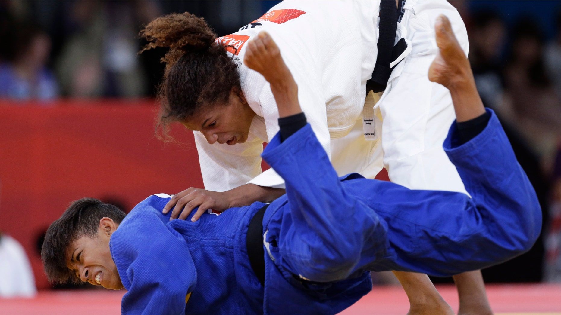 Miryam Roper of Germany competes with Rafaela Silva of Brazil, right, during the women's 57-kg judo competition at the 2012 Summer Olympics, Monday, July 30, 2012, in London. (AP Photo/Paul Sancya)