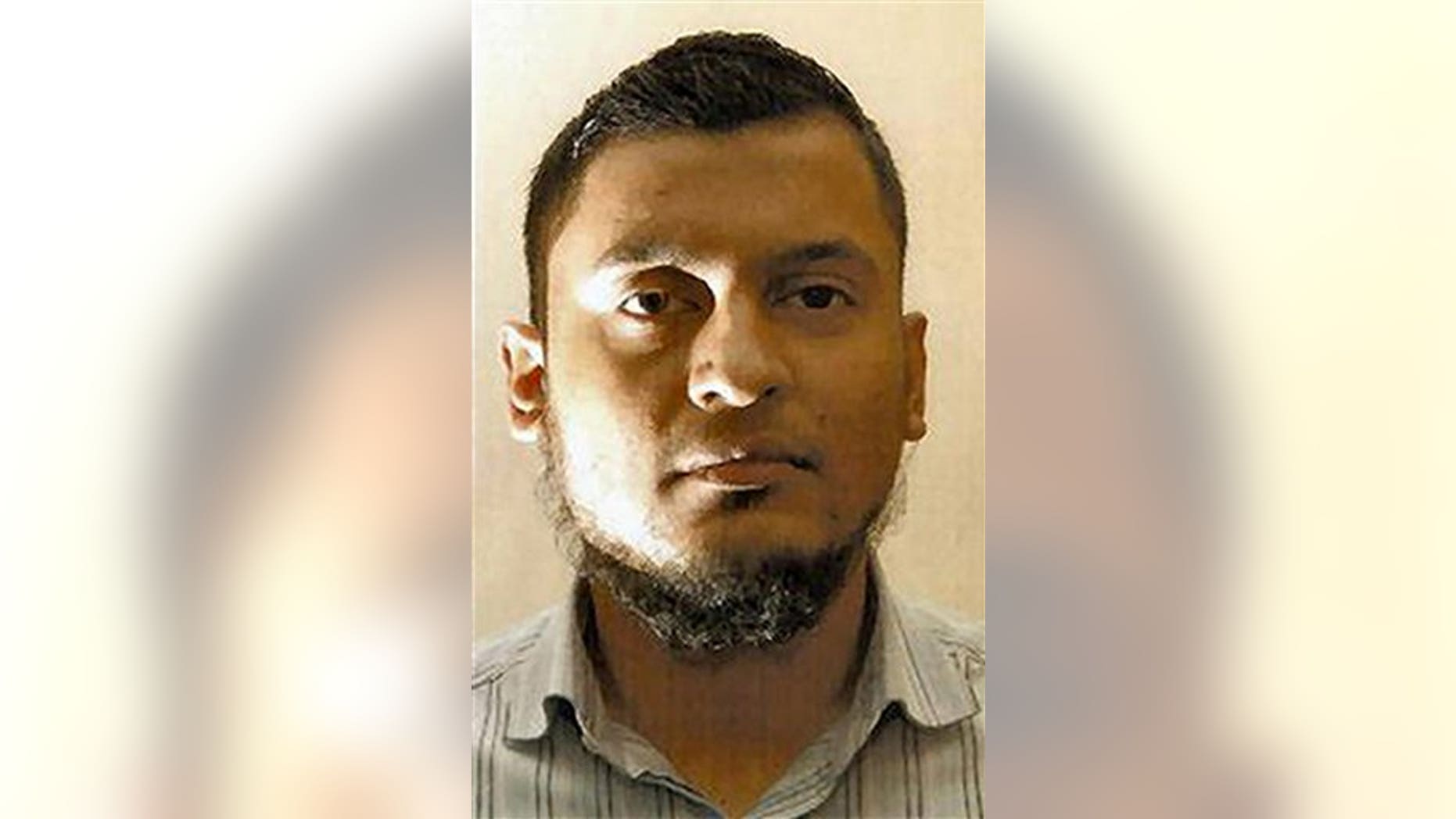 This undated photo released by the British Metropolitan Police shows Rajib Karim who was found guilty Monday Feb. 28, 2011 at Woolwich Crown Court in London of plotting to blow up a plane while working as a computer specialist with British Airways.