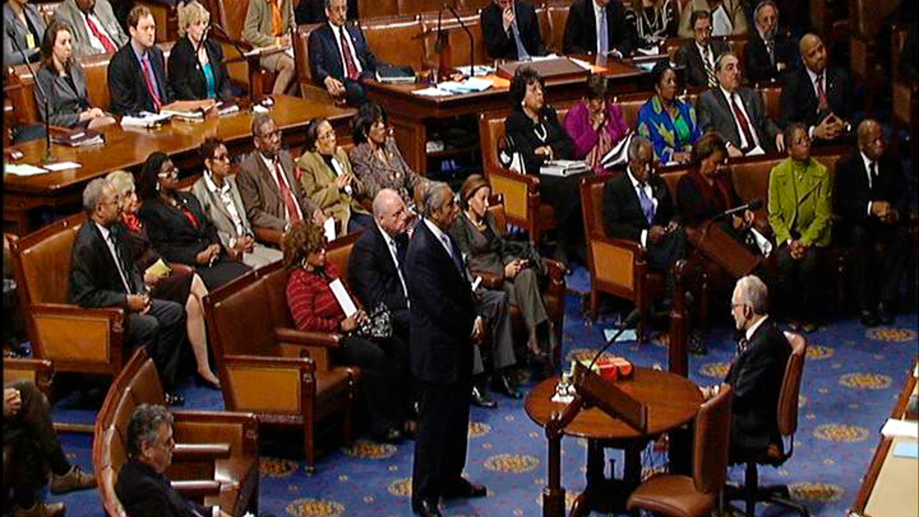 This video frame grab image provided by House Television shows Rep. Charles Rangel, D-N.Y., stands in the well on the House floor while House Speaker Nancy Pelosi reads the censure resolution passed by the House on Capitol Hill in Washington, Thursday, Dec. 2, 2010. (AP Photo/House Television)