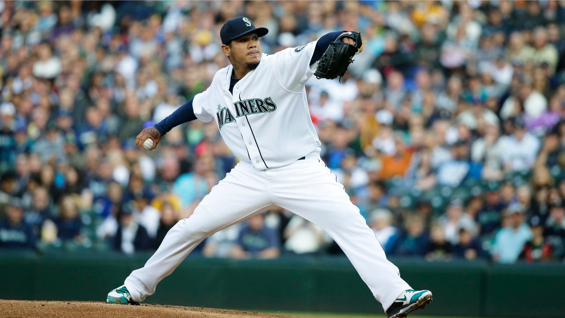 Seattle Mariners starting pitcher Felix Hernandez throws against the Texas Rangers in the first inning of a baseball game, Saturday, April 18, 2015, in Seattle. (AP Photo/Ted S. Warren)