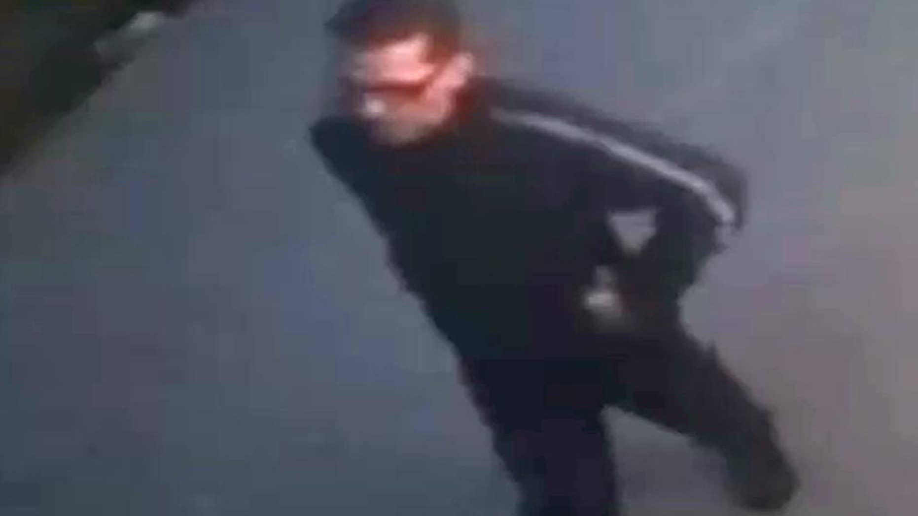 In this image from a surveillance video provided by the New York Police Department, a suspect is seen walking near a New York sports bar, Saturday, April 11, 2015. The suspect walked into the basement bathroom of the Turnmill Bar on East 27th Street on Saturday and hid inside a stall, police said. He allegedly then grabbed the 23-year-old woman, pulled her into a stall and raped her. (New York Police Department via AP)