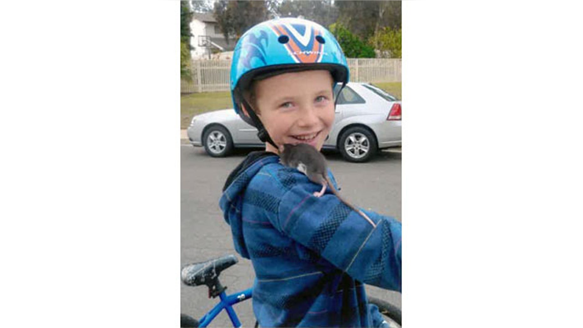 This undated photo released by Gomez Trial Attorneys courtesy the Pankey family, shows Aidan Pankey and one of his pet rats. Lawyers representing the Pankey family have filed a lawsuit against Petco Animal Supplies Inc., saying Aidan died from rat-bite fever contracted from a male rat purchased at one of the national chain's stores. (AP Photo/Courtesy Pankey Family)