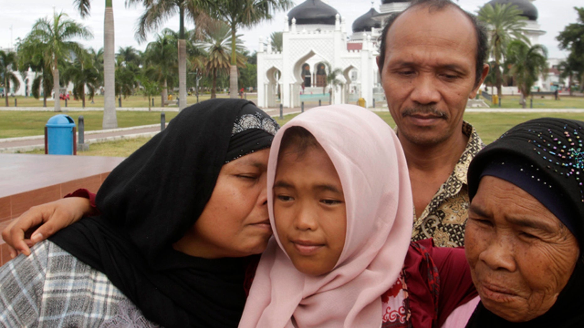 Raudhatul Jannah, was lost after being swept into the sea during the 2004 Indian Ocean tsunami. She was been found alive and living with a foster mother. She was reunited with her biological parents this week. (REUTERS/Junaidi Hanafiah)