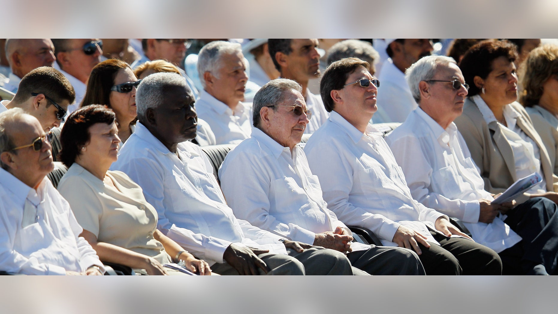 HAVANA, CUBA - MARCH 28: Cuban President Raul Castro (C) listens as Pope Benedict XVI conducts a mass at Havana's Revolution Square on the last day of his three day visit on March 28, 2012 in Havana, Cuba. Fourteen years after Pope John Paul II visited Cuba, Pope Benedict is making his first trip to the communist country. (Photo by Joe Raedle/Getty Images)