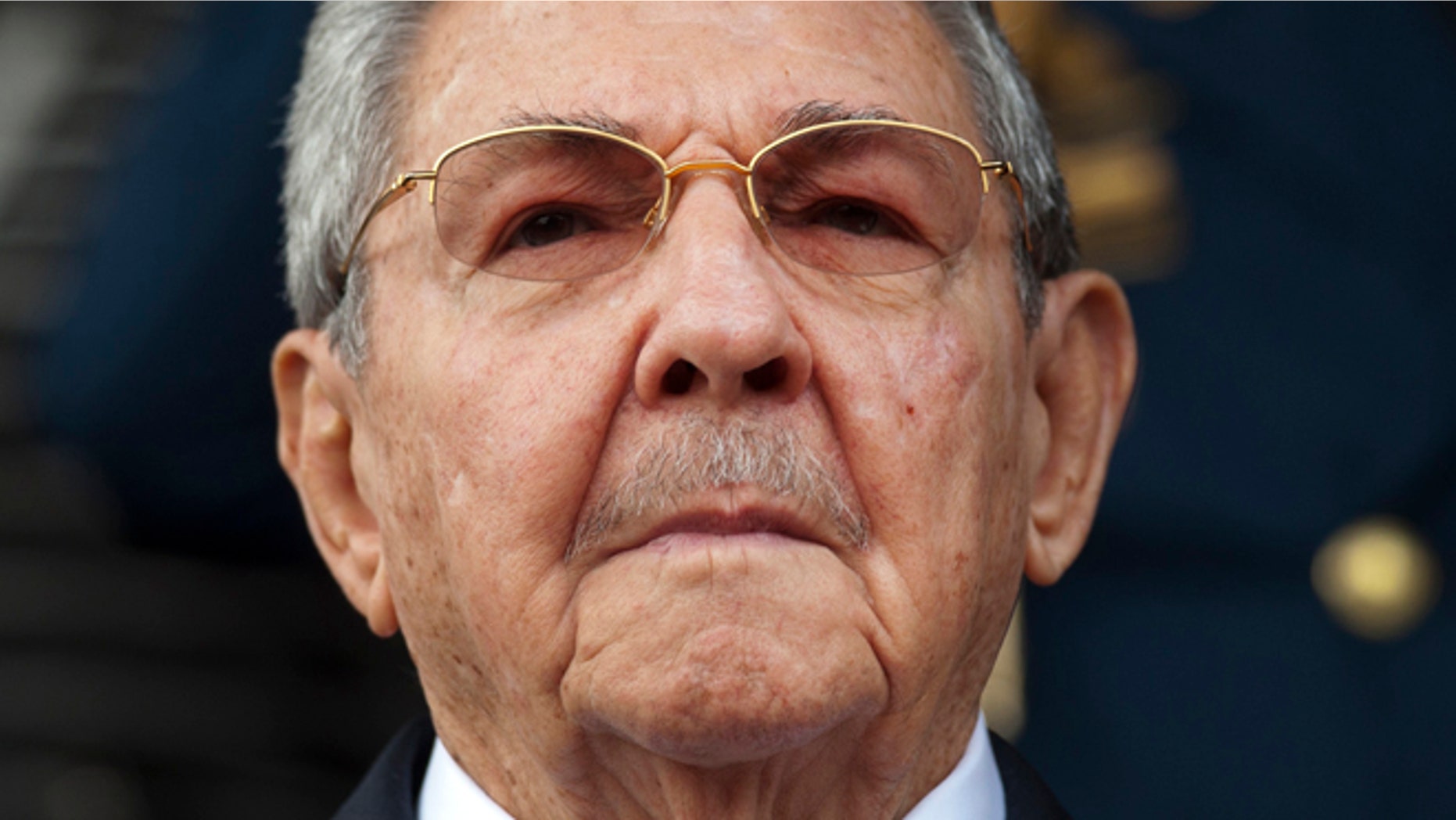 Cuba's President Raul Castro listens to the playing of national hymns during his welcome ceremony at Miraflores presidential palace before the start of an emergency ALBA meeting in Caracas, Venezuela, Tuesday, March 17, 2015. Leftist allies of Venezuela on Tuesday rallied behind embattled President Nicolas Maduro in his faceoff with the U.S. government, which he is accusing of trying to oust his socialist administration. (AP Photo/Ariana Cubillos)