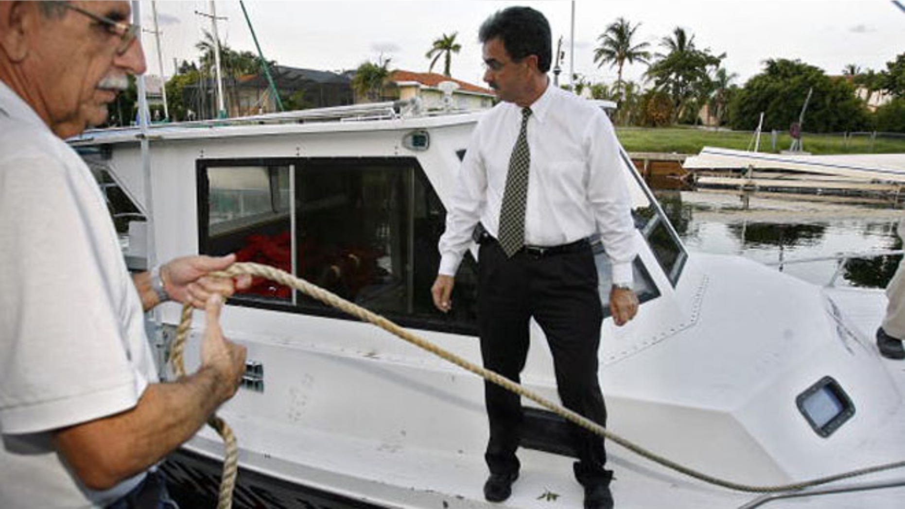 Ramon Saul Sanchez, in a white shirt, in a 2006 file photo.