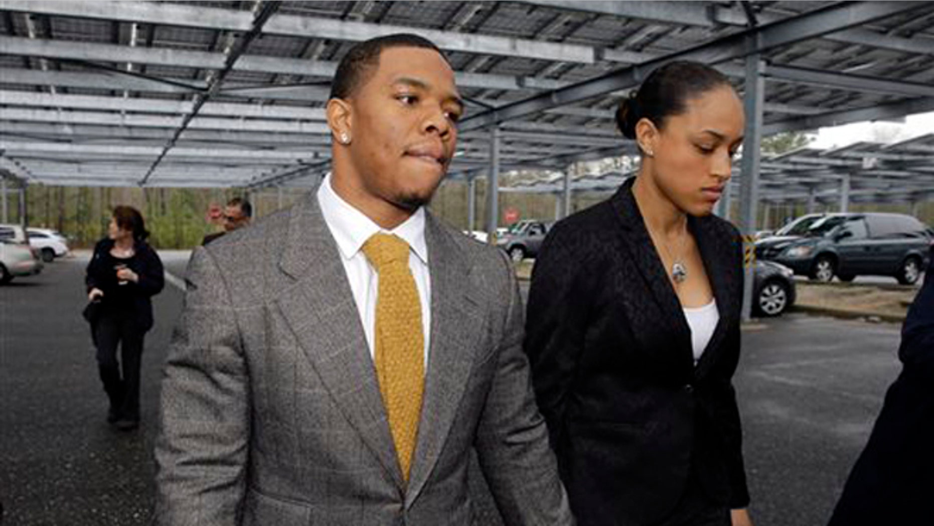 FILE - In this May 1, 2014, file photo, Baltimore Ravens football player Ray Rice holds hands with his wife, Janay Palmer, as they arrive at Atlantic County Criminal Courthouse in Mays Landing, N.J. Banter by two "Fox & Friends" hosts about video showing Rice hitting his then future wife is under fire. The hosts, Brian Kilmeade and Steve Doocey, made their on-air comments Monday, Sept. 8, 2014, while discussing newly released elevator video showing Rice hitting Janay Palmer in February. (AP Photo/Mel Evans, File)