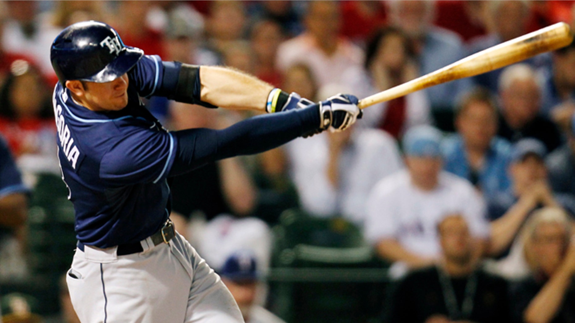Tampa Bay Rays' Evan Longoria doubles during the sixth inning of an American League wild-card tiebreaker baseball game against the Texas Rangers Monday, Sept. 30, 2013, in Arlington, Texas. (AP Photo/Tim Sharp)