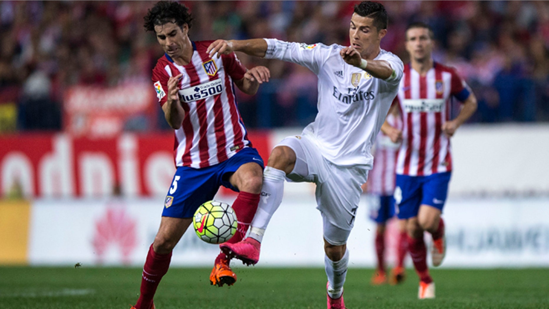 MADRID, SPAIN - OCTOBER 04: Cristiano Ronaldo (R) of Real Madrid CF competes for the ball with Tiago Mendes (L) of Atletico de Madrid during the La Liga match between Club Atletico de Madrid and Real Madrid CF at Vicente Calderon Stadium on October 4, 2015 in Madrid, Spain. (Photo by Gonzalo Arroyo Moreno/Getty Images)