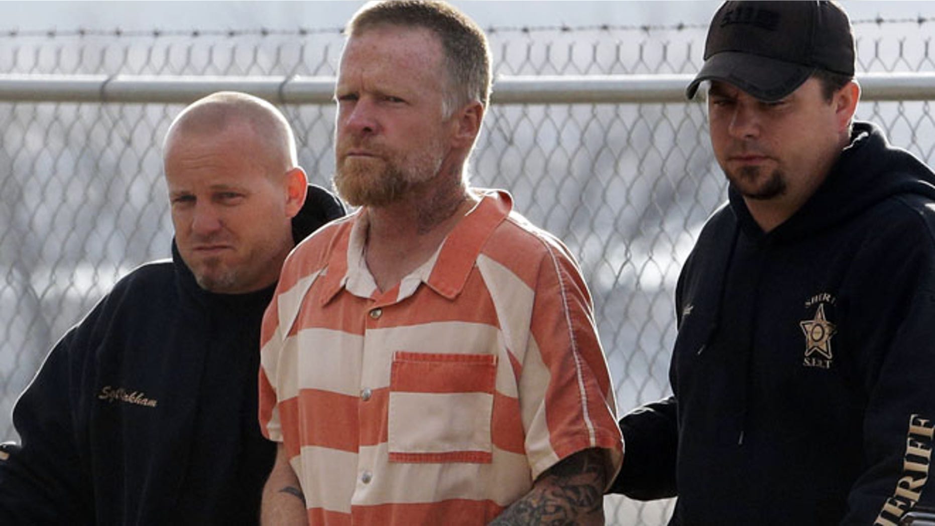 April 2: Sanpete Sheriff's Officers escort Troy James Knapp, 45, to the Sanpete County Jail Tuesday in Manti, Utah