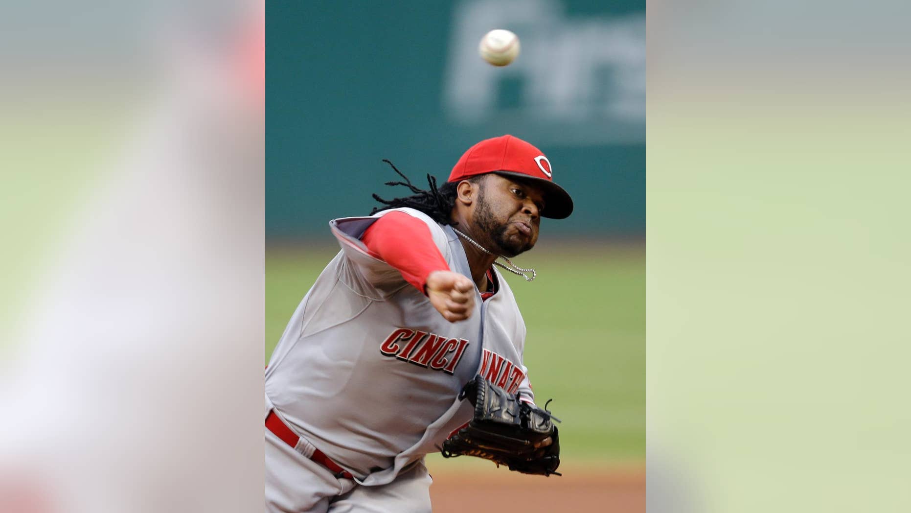 Cincinnati Reds starting pitcher Johnny Cueto delivers against the Cleveland Indians in the first inning of a baseball game Tuesday, Aug. 5, 2014, in Cleveland. (AP Photo/Mark Duncan)