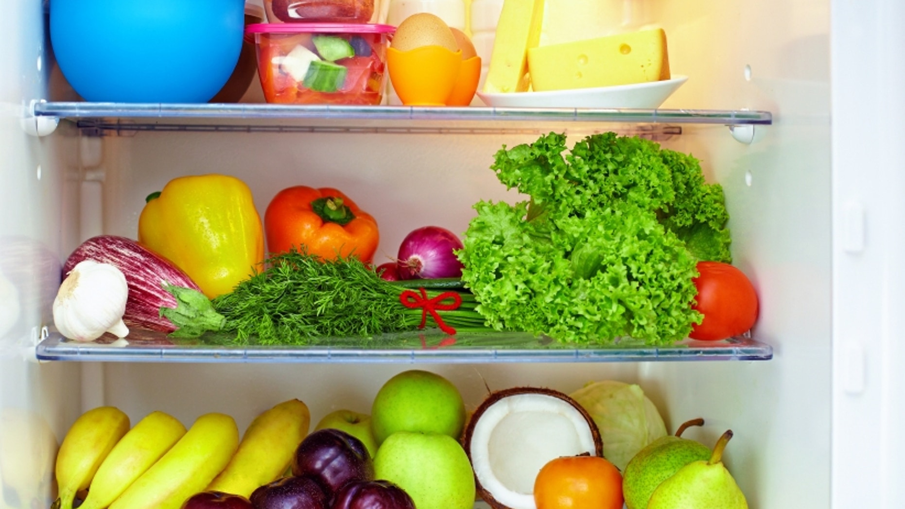 refrigerator full of healthy food. friuts and vegetables
