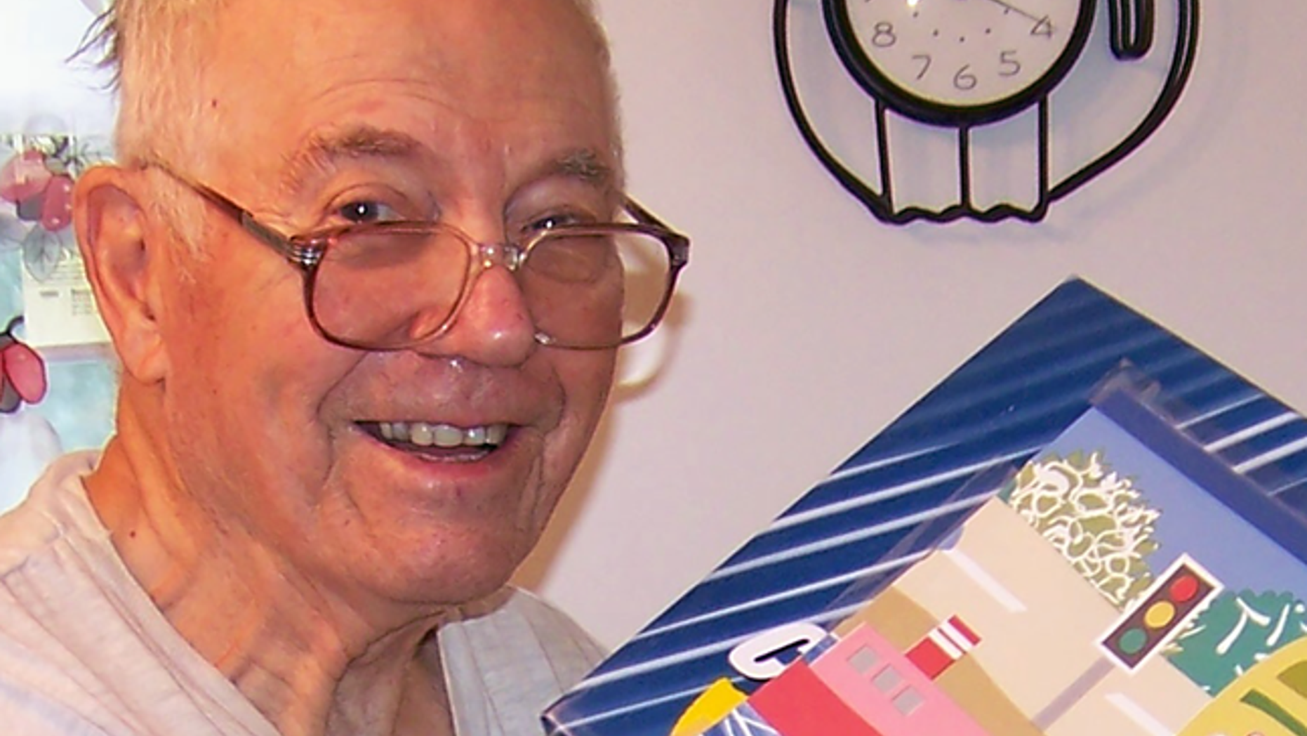 WWII veteran Reggie Peterson, 92, readies boxes for Operation Christmas Child.