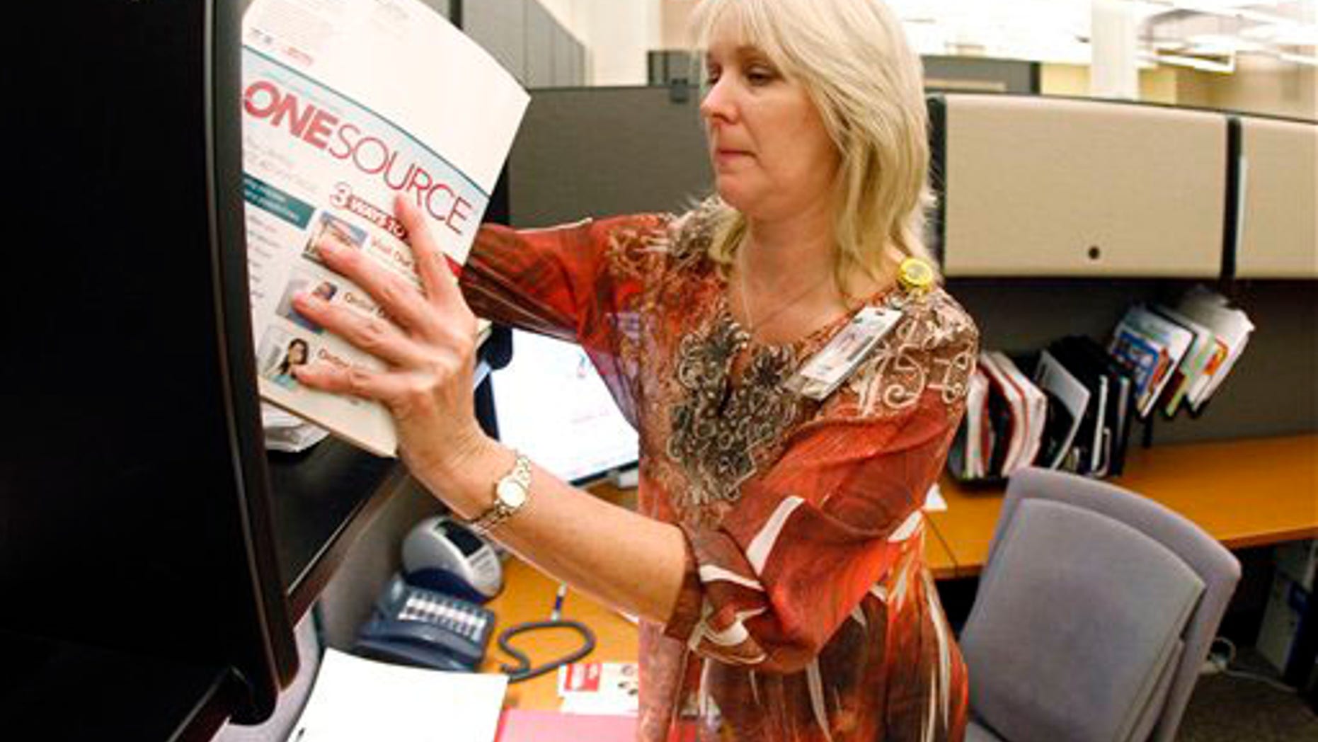 Jennie Taylor, a marking coordinator at LifeWay Christian Resources, works in her office on Wednesday, Oct. 6, 2010, in Nashville, Tenn. Lifeway has a partnership with backgrounchecks.com to offer background screenings to Lifeway customers at discounted prices. Taylor said that many churches are now doing background checks on employees. "If they're not doing it, they're considering it and looking for options and sources to do it," Taylor said.