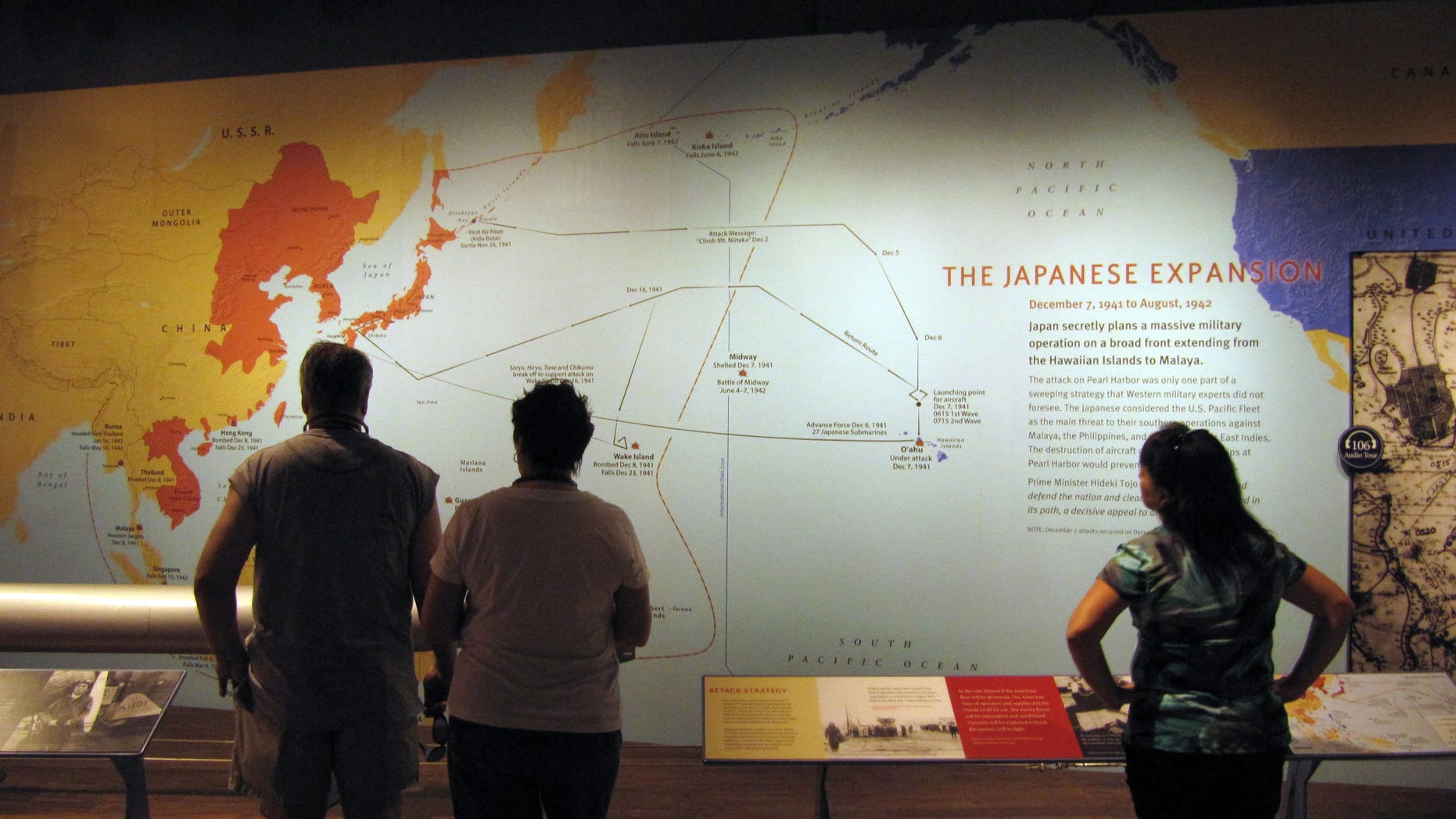 April 15, 2011: Visitors to the USS Arizona Memorial look at a display at Pearl Harbor, Hawaii. Visitors to Pearl Harbor are seeing snapshots of 1930s Japan as they stroll through the National Park Service's new museum about the Dec. 7, 1941 attack that dragged the U.S. into World War II.
