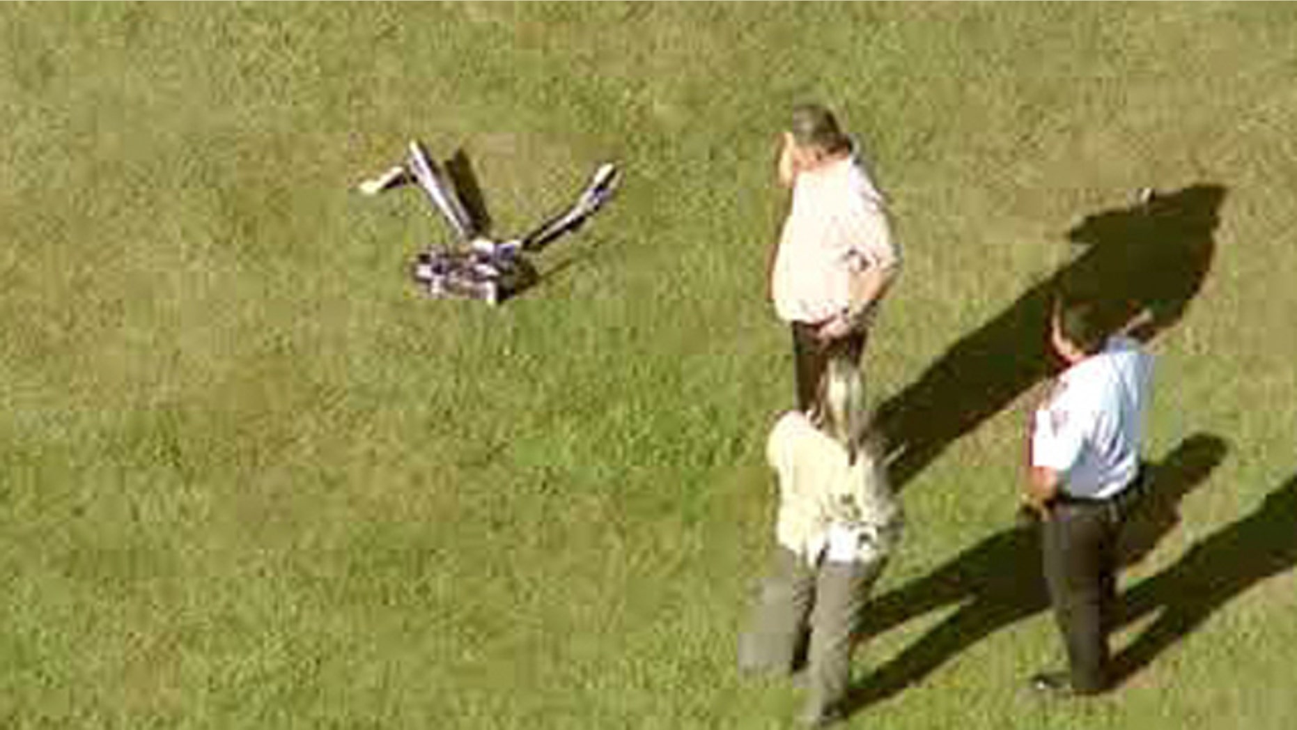 Sept. 5, 2013: In this image taken from video and provided by WABC-TV in New York, investigators stand near a remote controlled toy helicopter that apparently struck and killed a 19-year-old man.