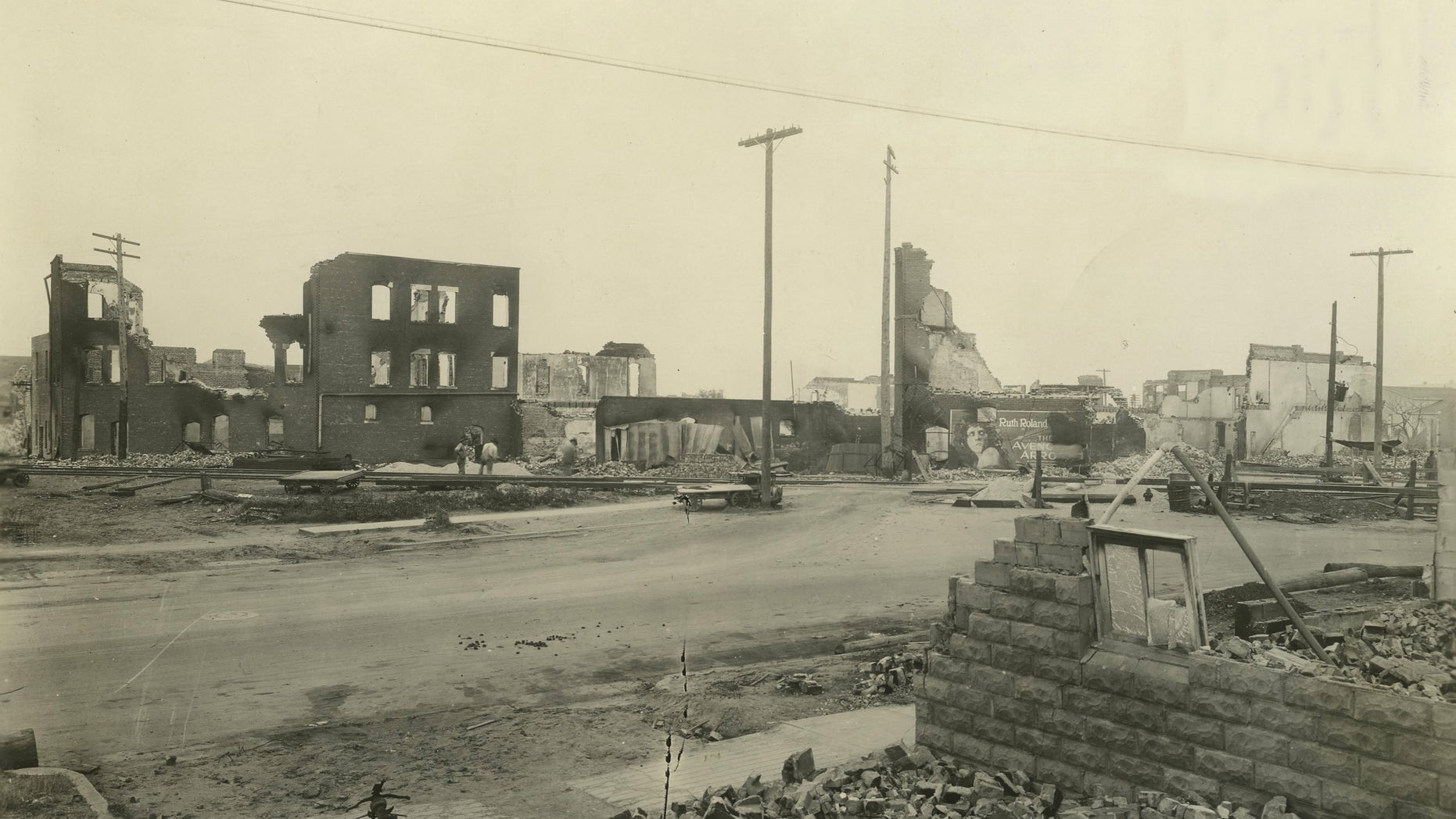 In this June 1, 1921, photo provided by the Tulsa Historical Society are businesses that were burned and looted in Tulsa's Greenwood District during race riots that left 300 blacks dead and hundreds more wounded in a span of 18 hours. Wyatt Tate Brady, who arrived in Tulsa in 1890, had become a man of means and influence by the time the territory became Oklahoma in 1907.