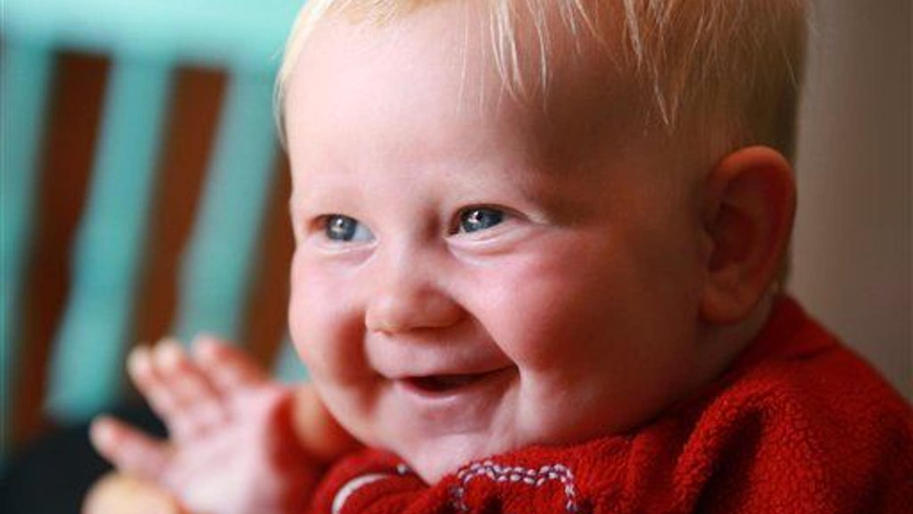 This May 7, 2011 photo shows a 4-month-old baby smiling in Toronto.