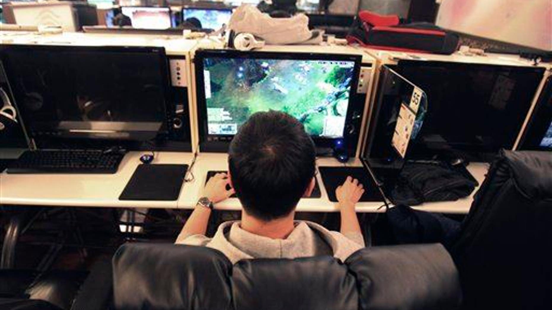 A college student plays online computer games at an Internet cafe in Seoul, South Korea.